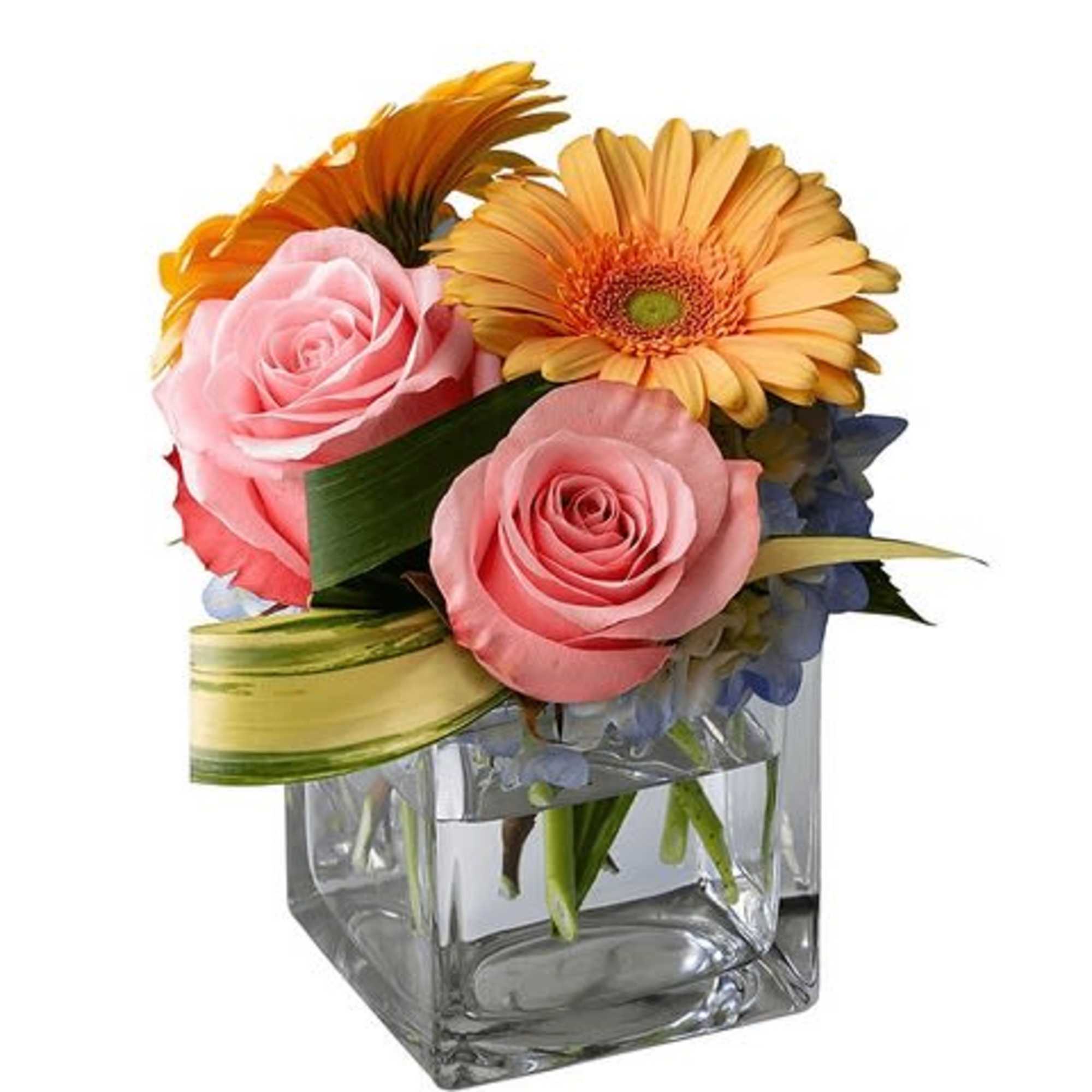 Pink roses and orange gerbera daisies in a square glass vase