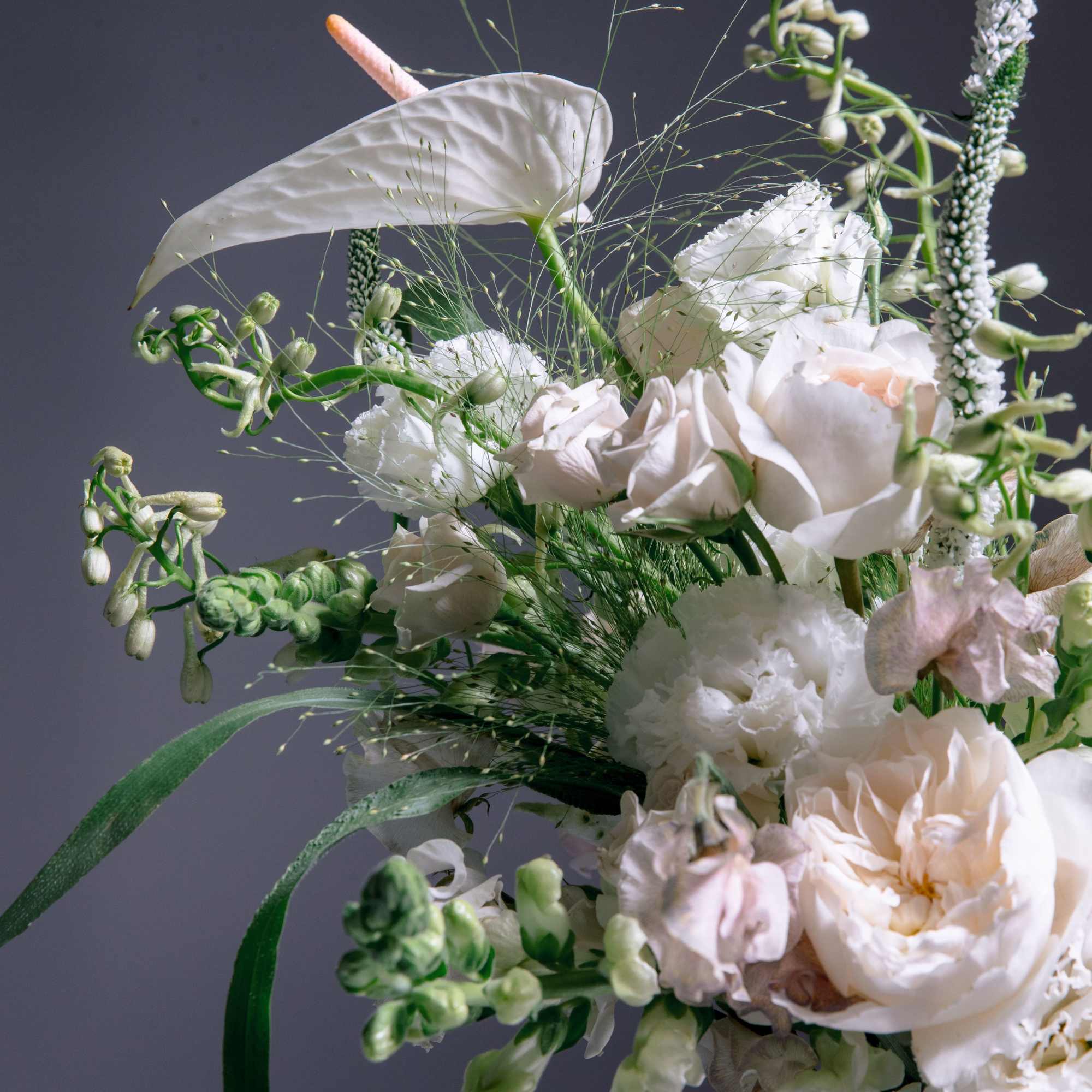 ALL DESIGNS IN PHOTOS ARE DELUXE +
Creamy ivory and blush blooms float, photo 2 of 3
