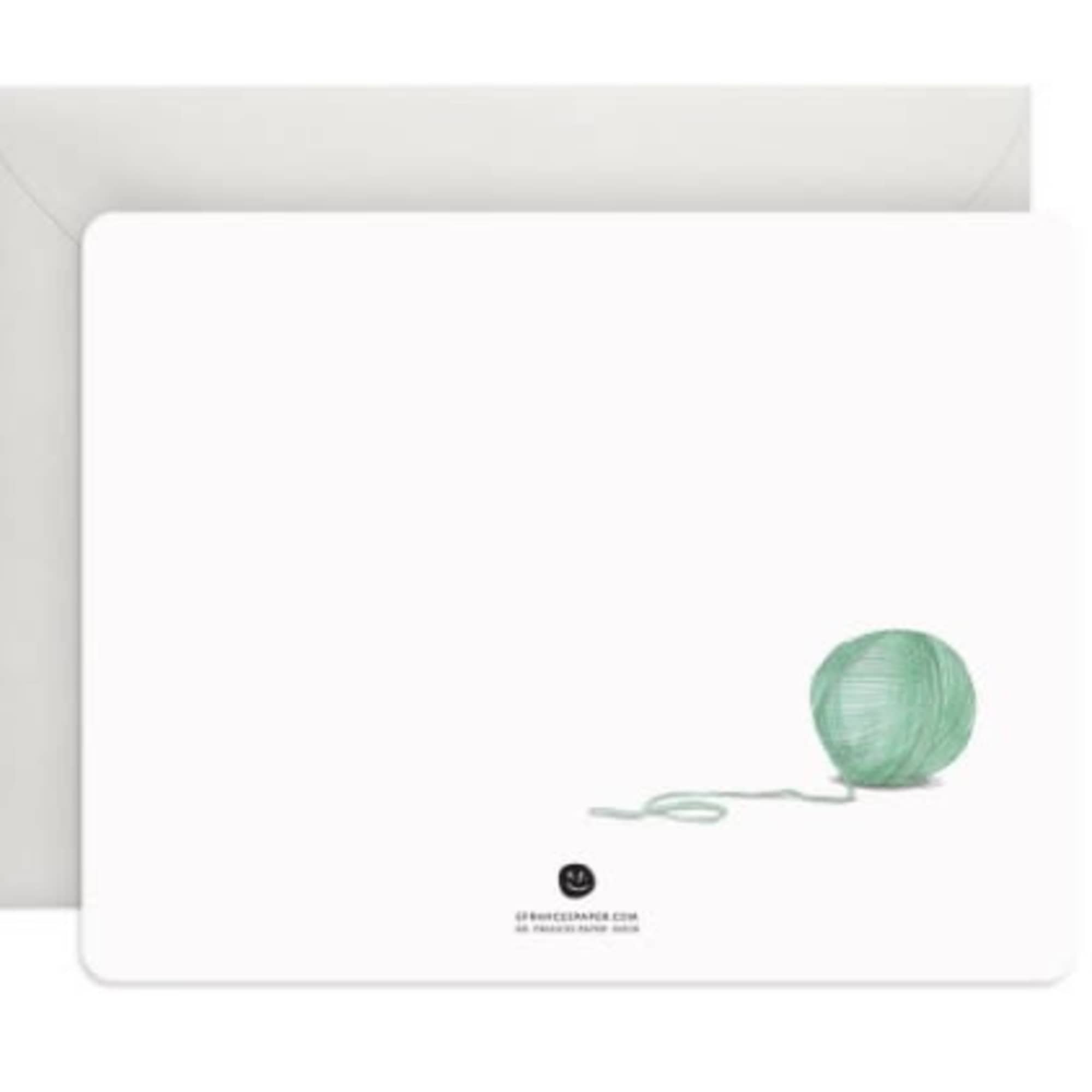 White card with a mint green yarn ball illustration