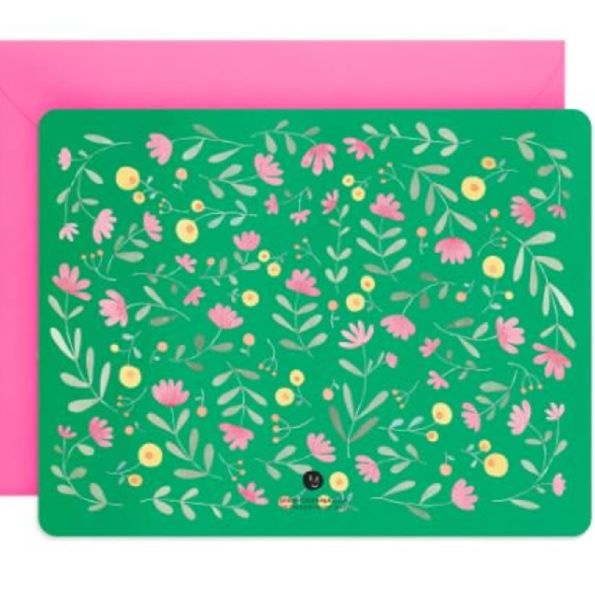 Pink envelope behind a green floral-patterned card