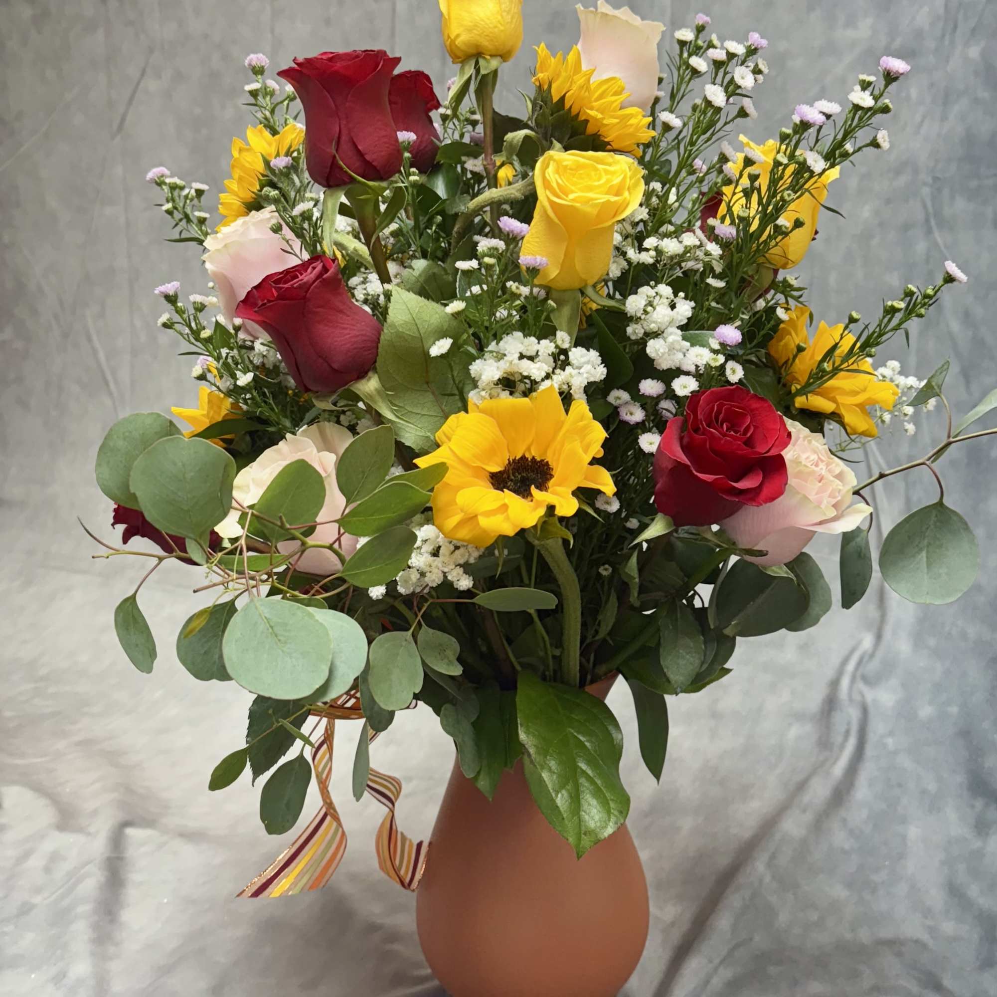 Bouquet of red and yellow roses with sunflowers in a vase, photo 2 of 2
