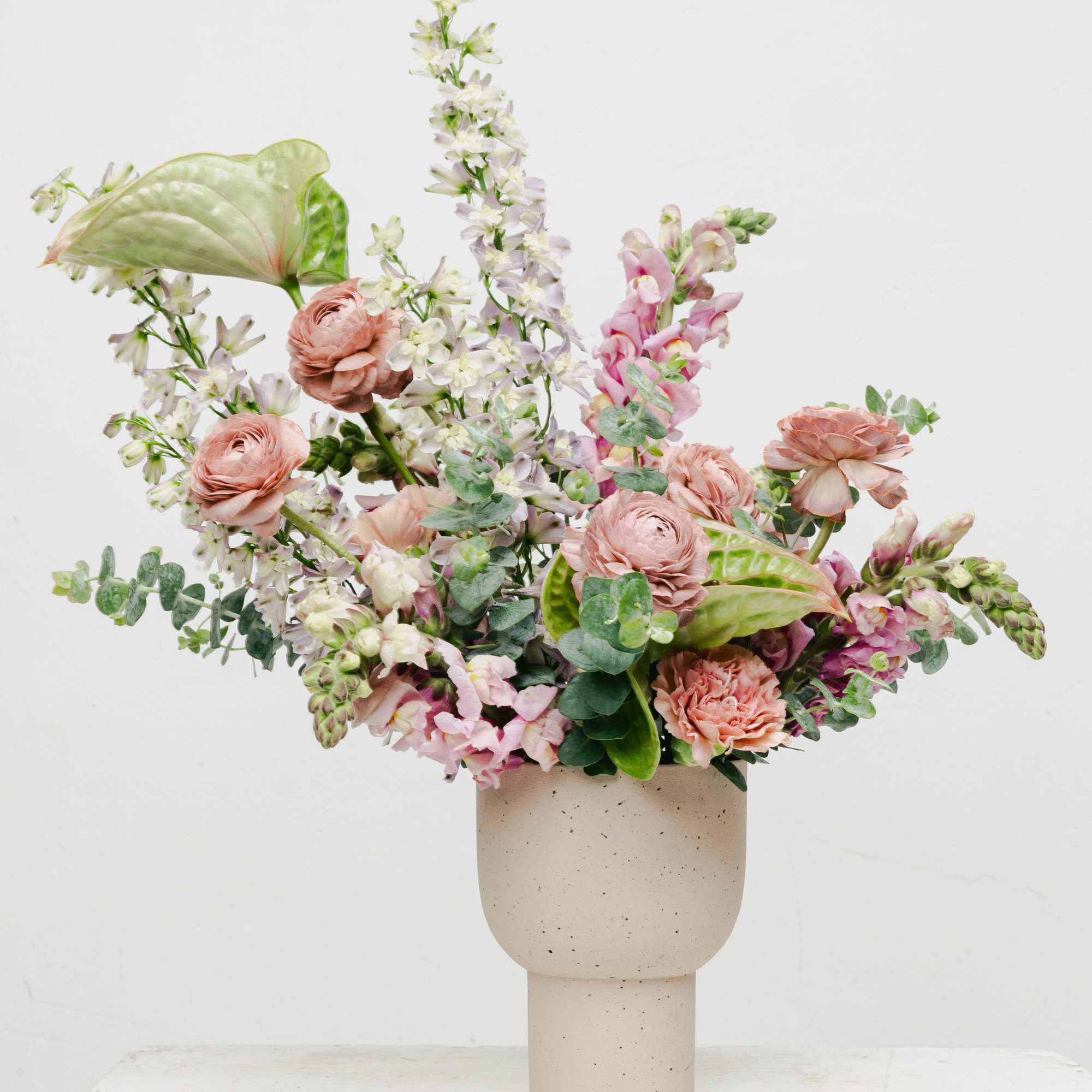 Discover the elegance of our Artful Mauve and Green Flower Arrangement, an
