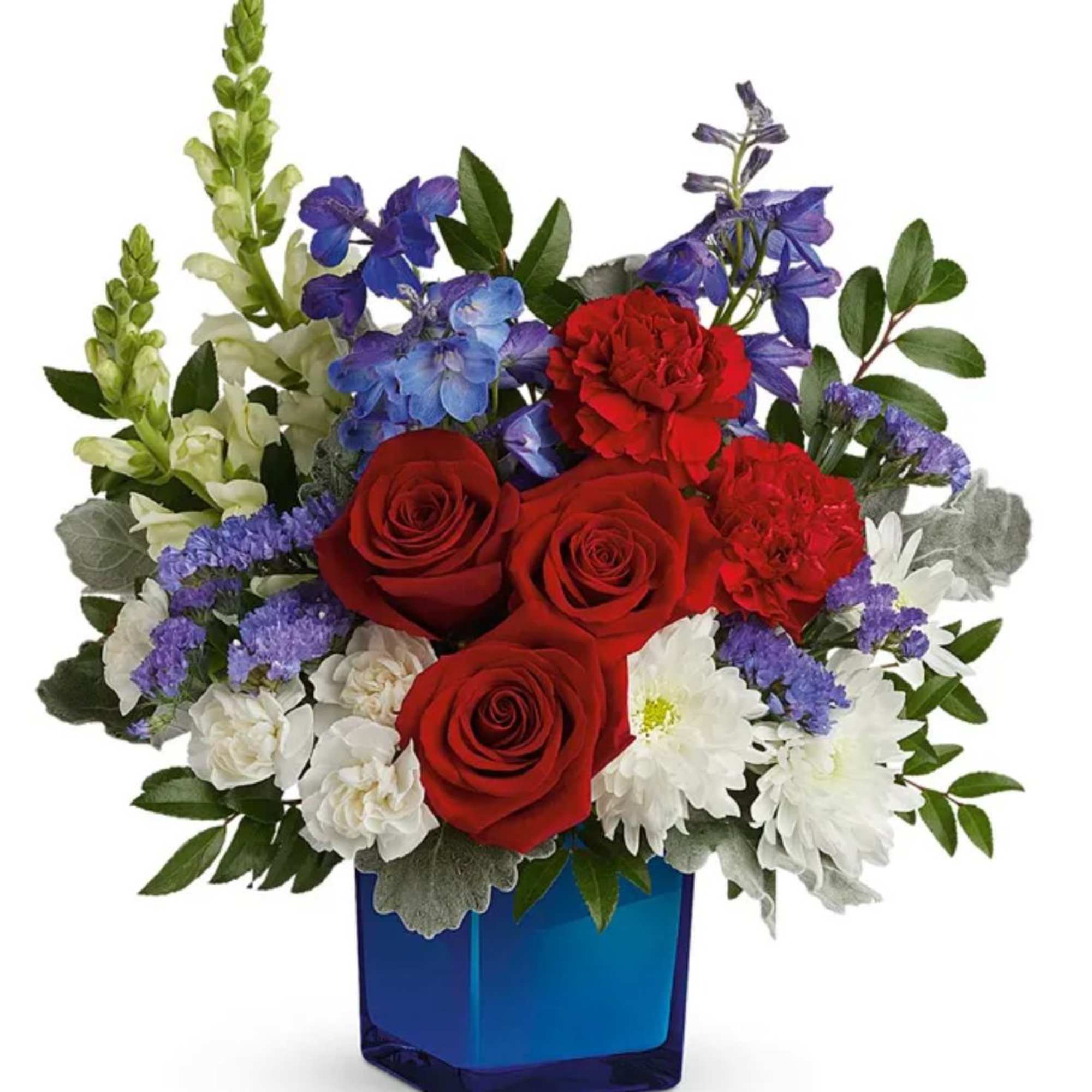 Red roses, white daisies, and purple flowers in a blue vase