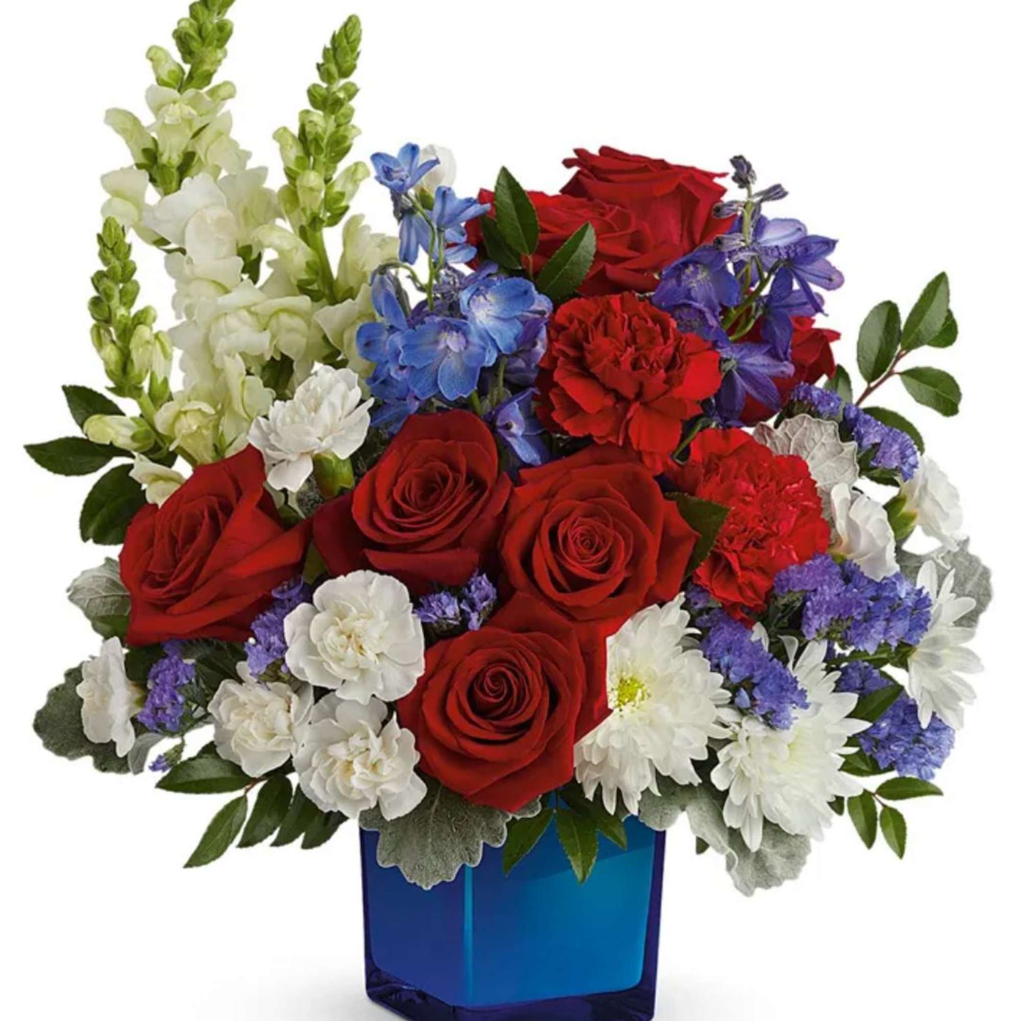 Red roses, white blooms, and blue flowers in a blue vase