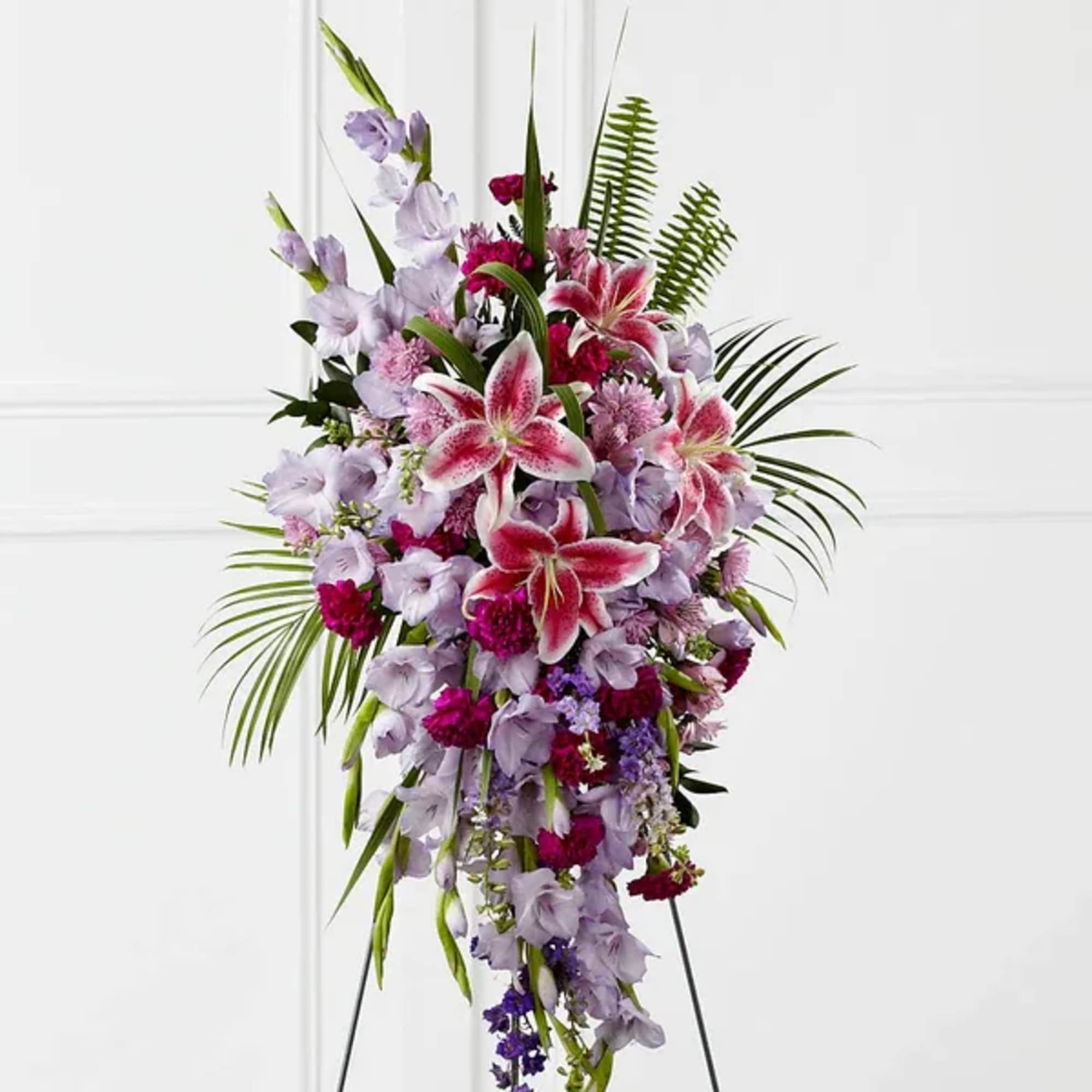 Tall standing spray of pink and lavender lilies and mixed flowers