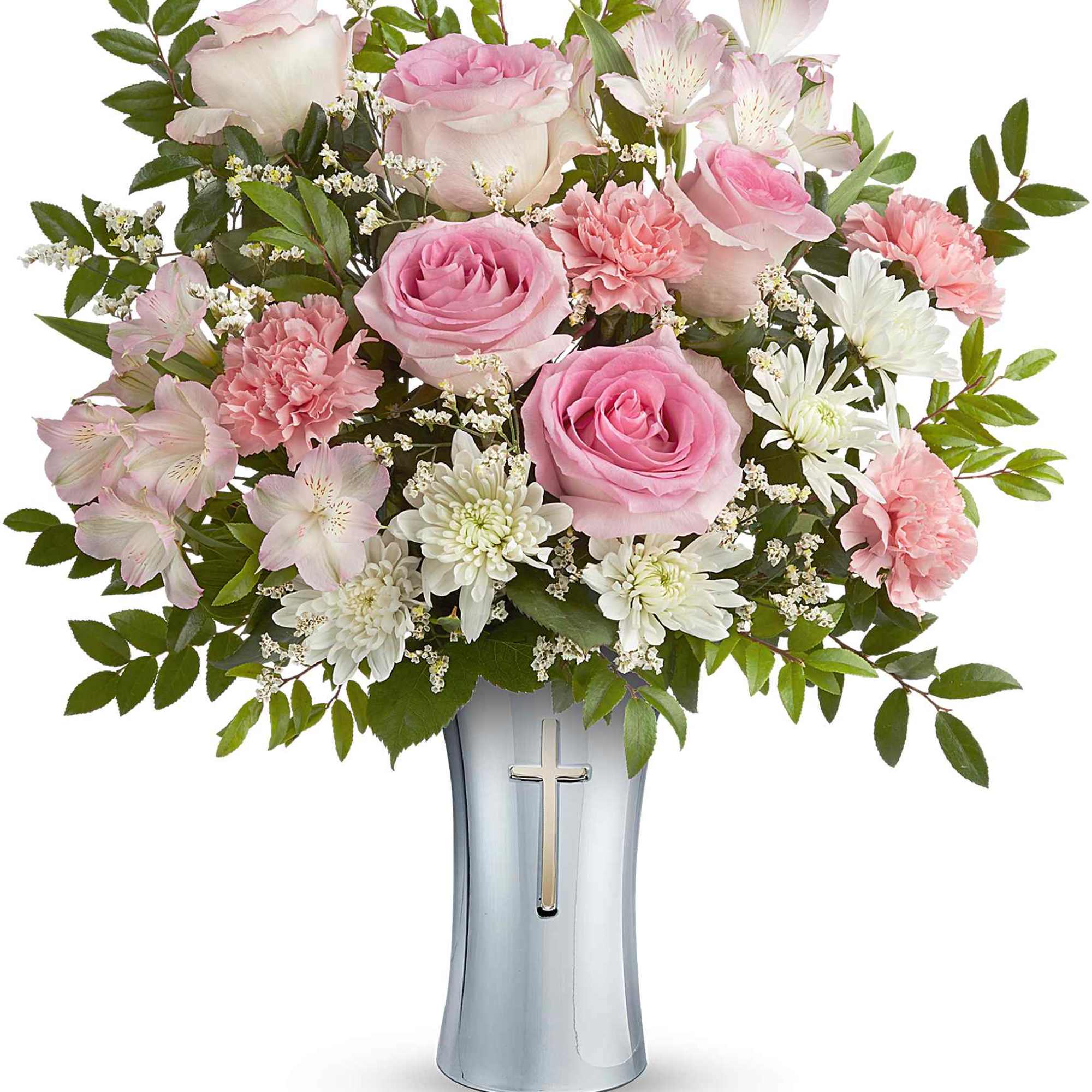 Pink and white flower arrangement in a silver vase with a cross