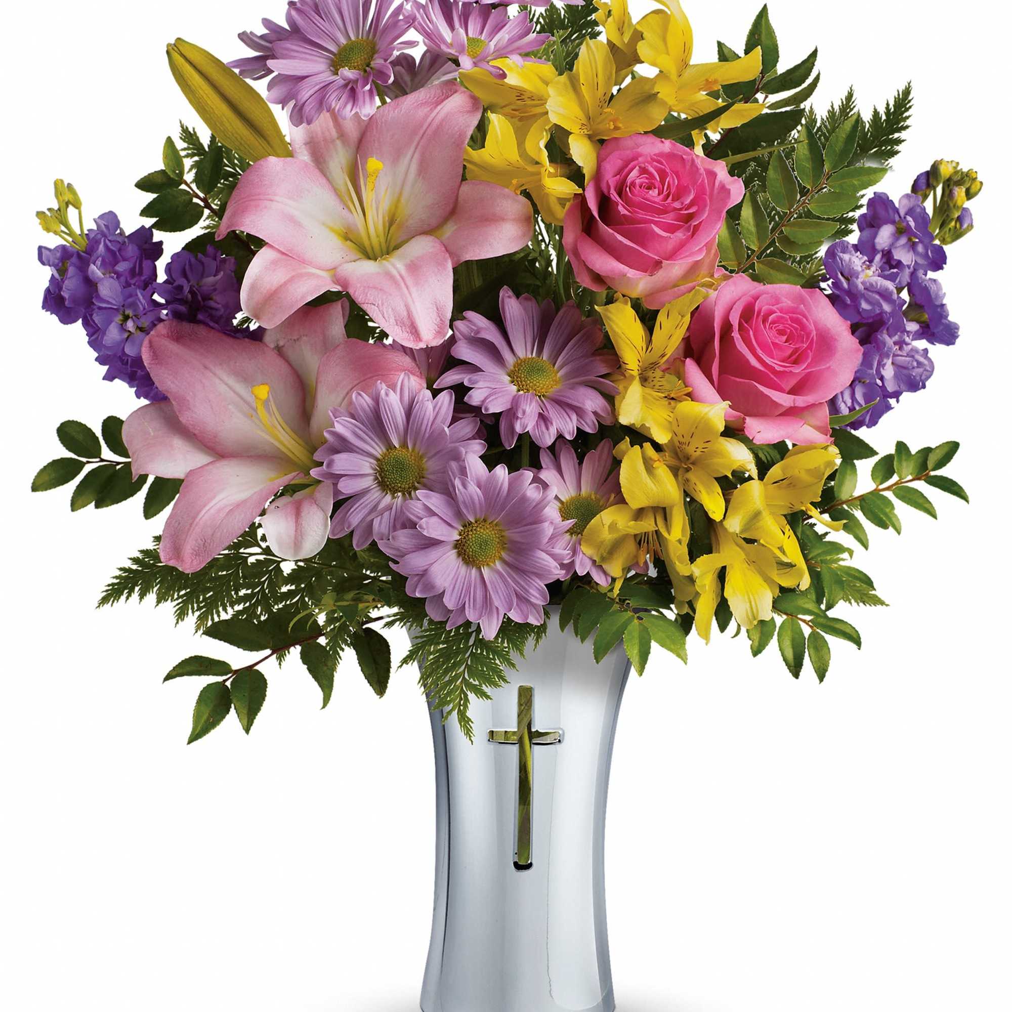 Pink lilies, roses, and purple daisies in a silver vase with a cross