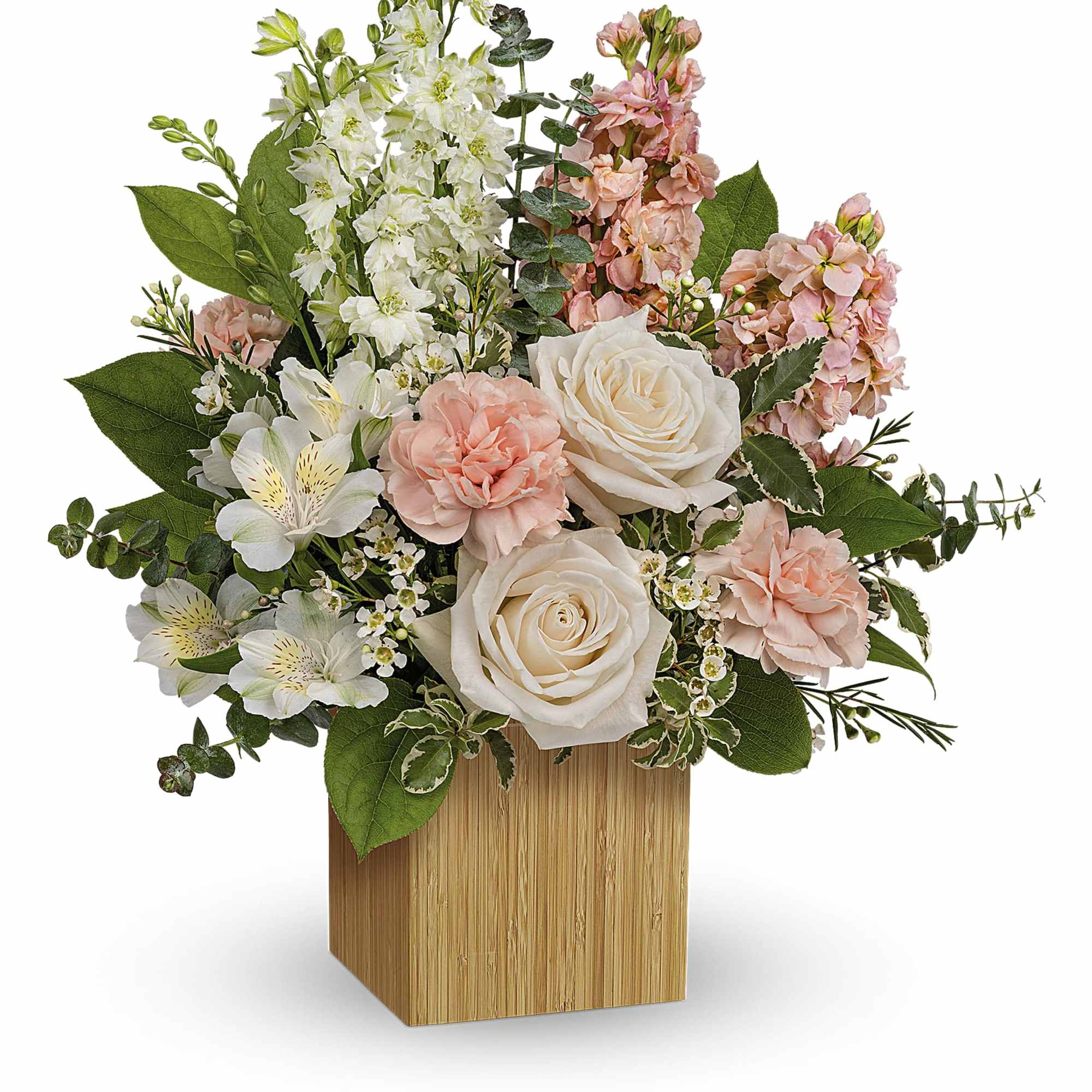 Pink and white floral arrangement in a wooden cube vase