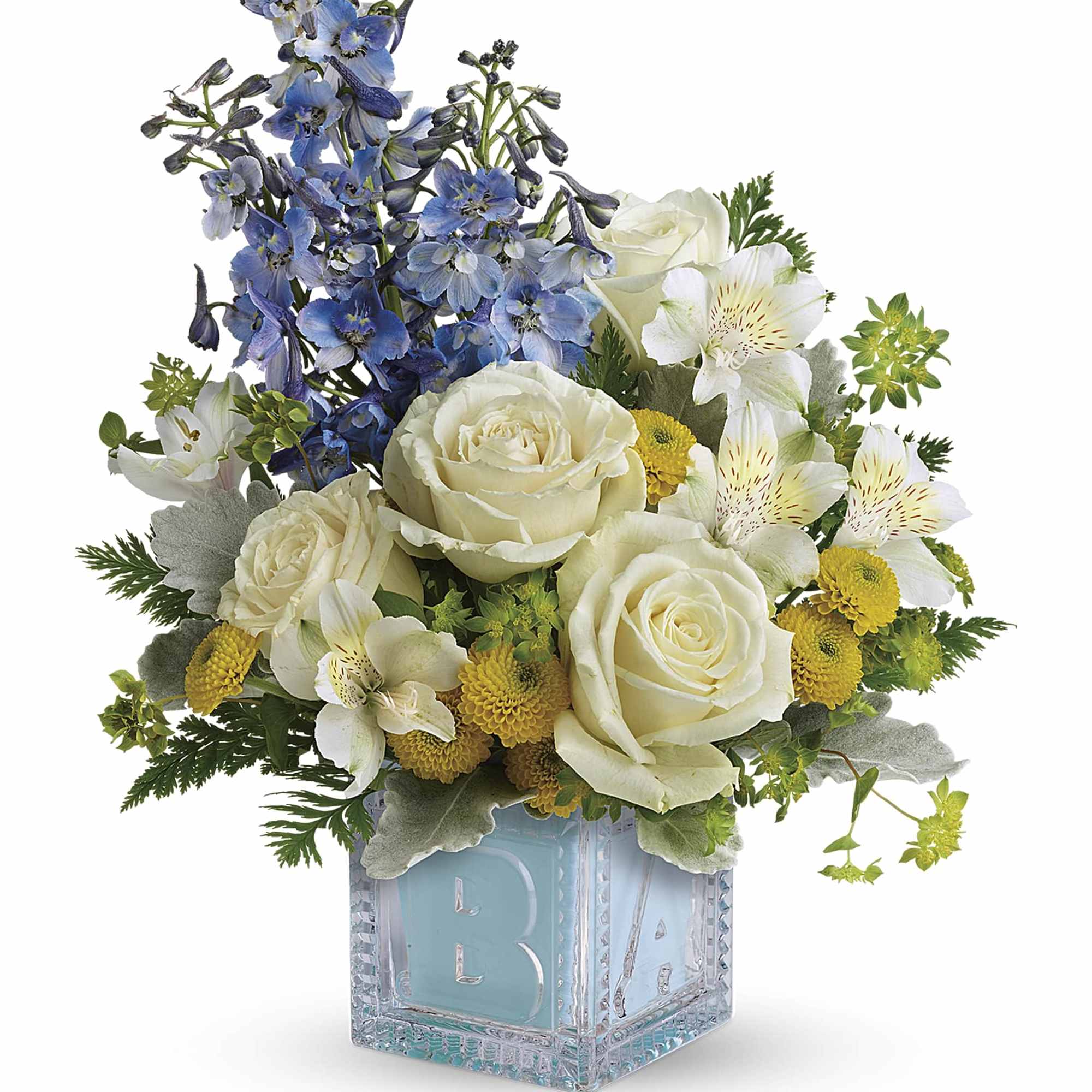 Blue and white floral arrangement in a clear glass cube vase
