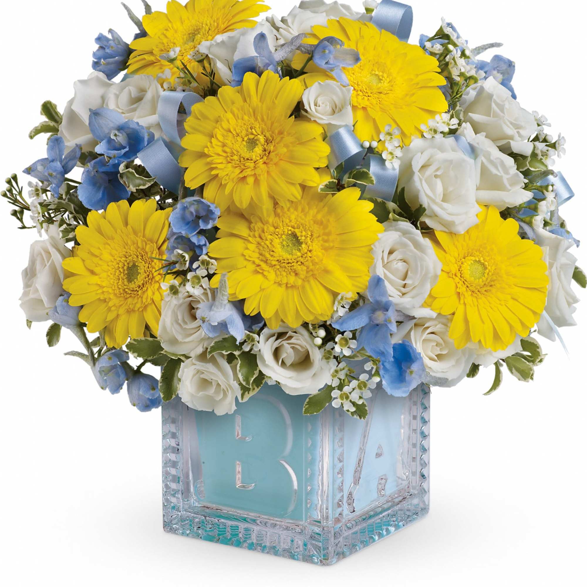 Yellow gerbera daisies and white roses in a glass cube vase