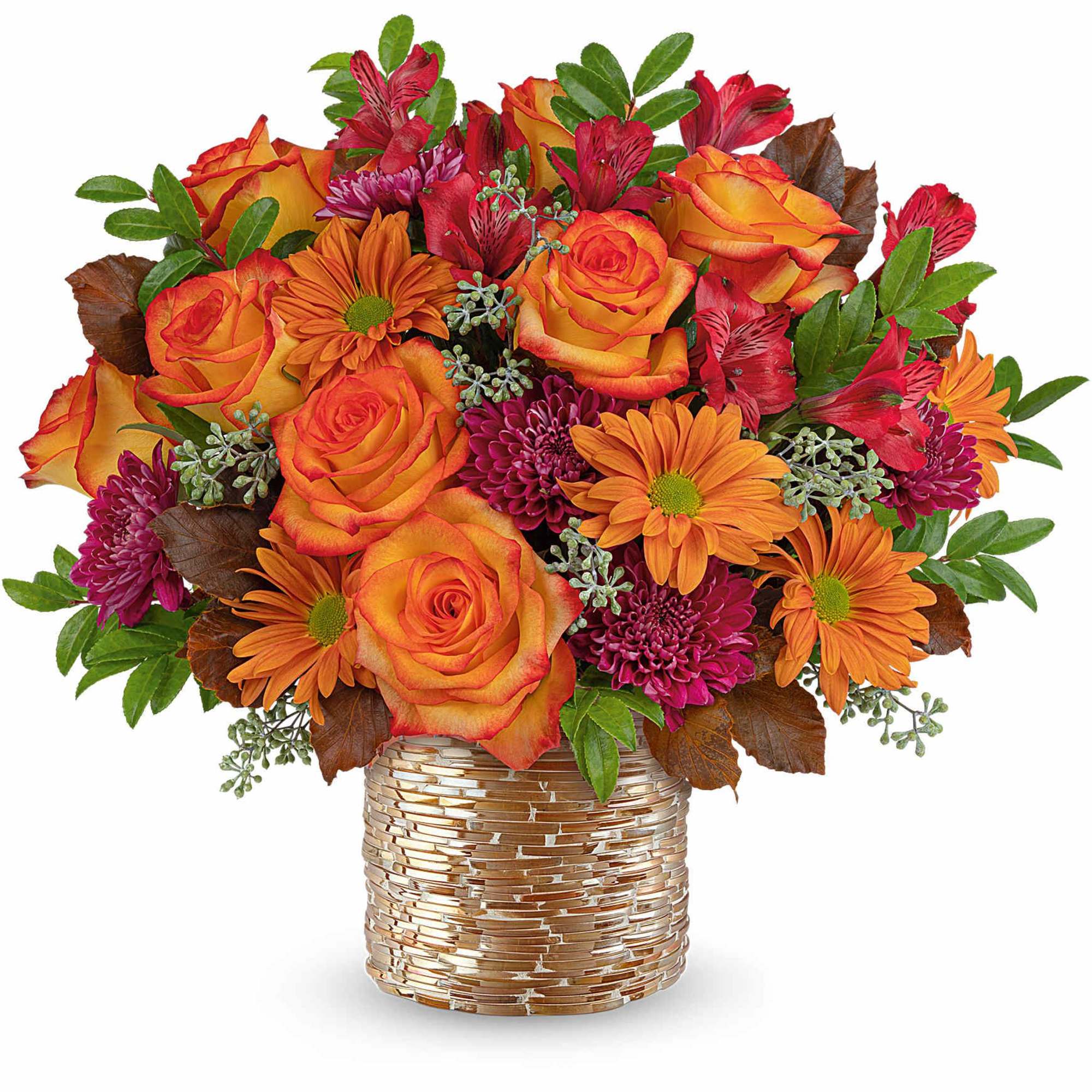 Orange roses and daisies in a gold-textured vase