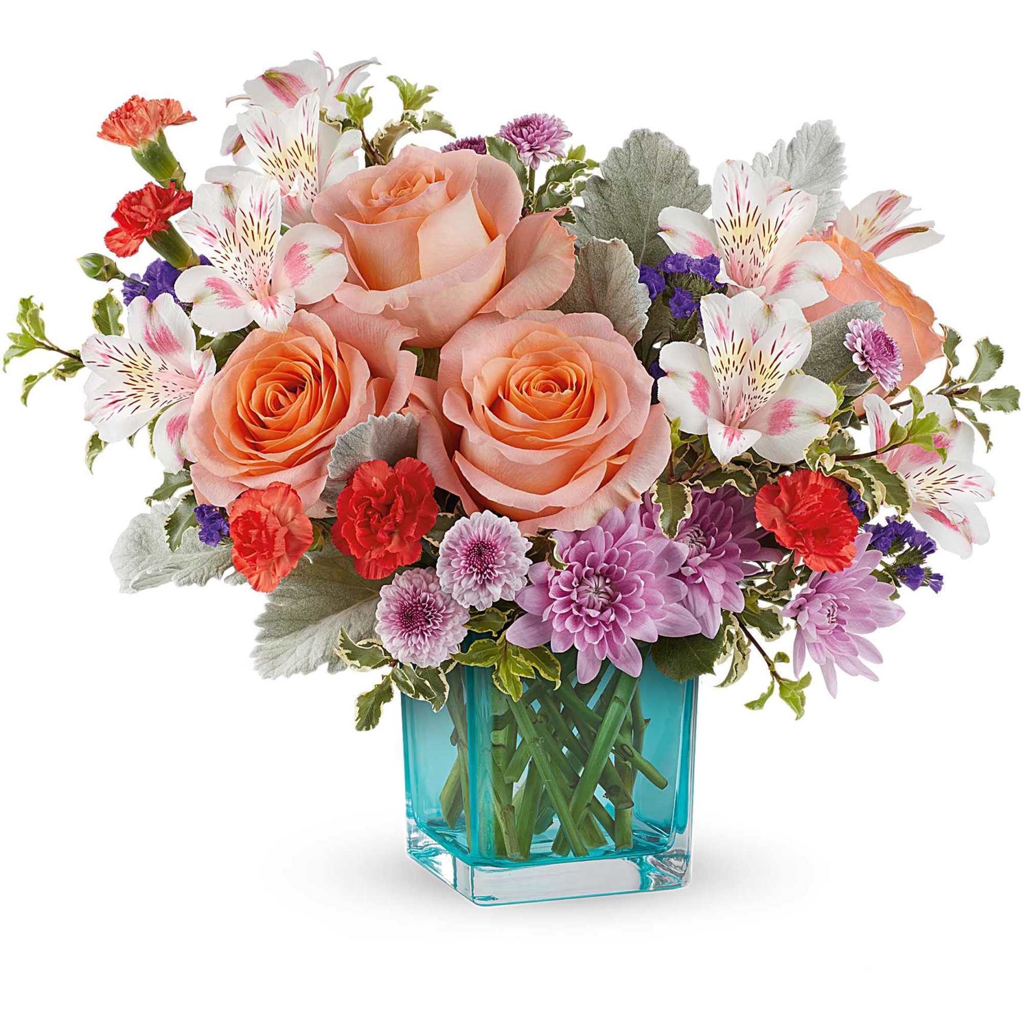 Peach roses and mixed pink flowers in a blue glass vase