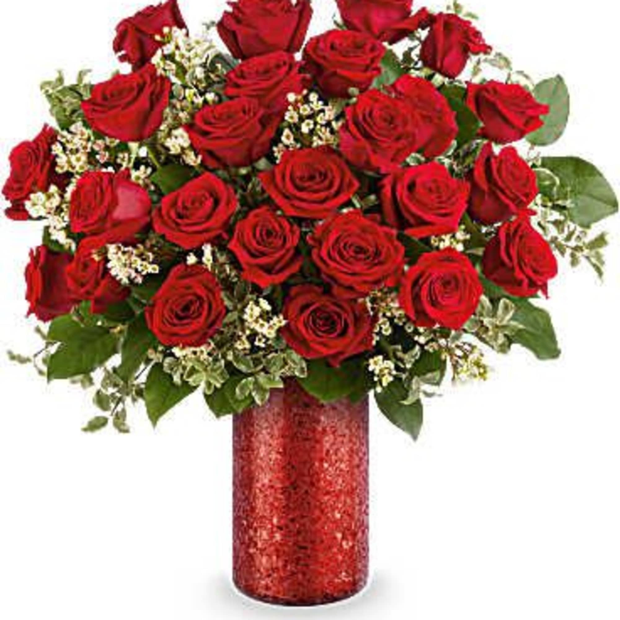 Red roses arranged in a red vase with white filler flowers