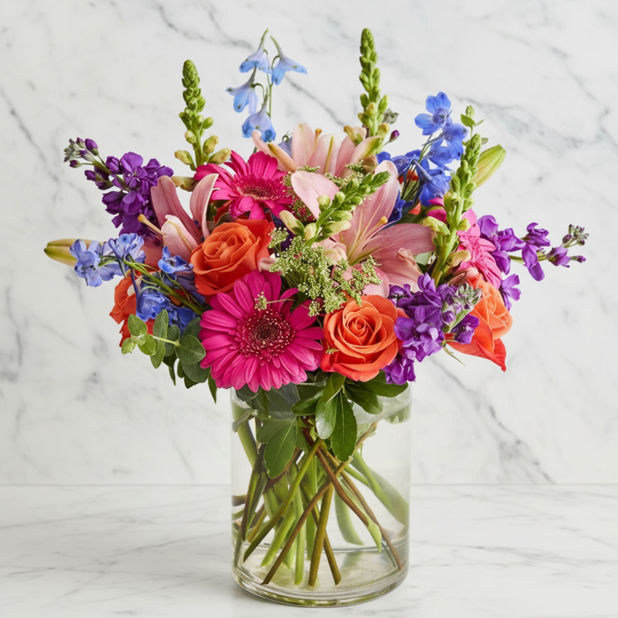 Colorful mixed bouquet in a clear glass vase