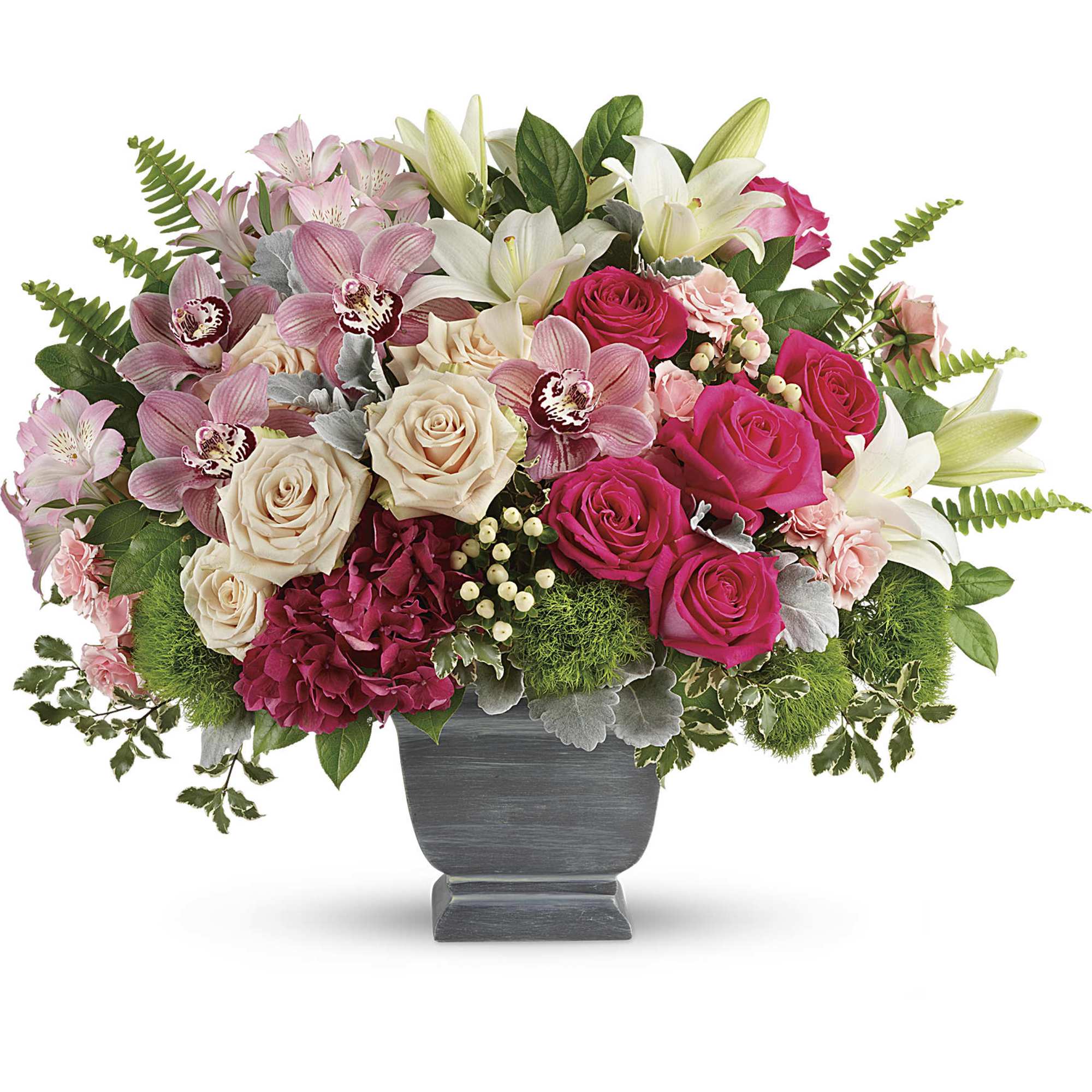 Pink and cream roses with lilies in a gray pedestal vase