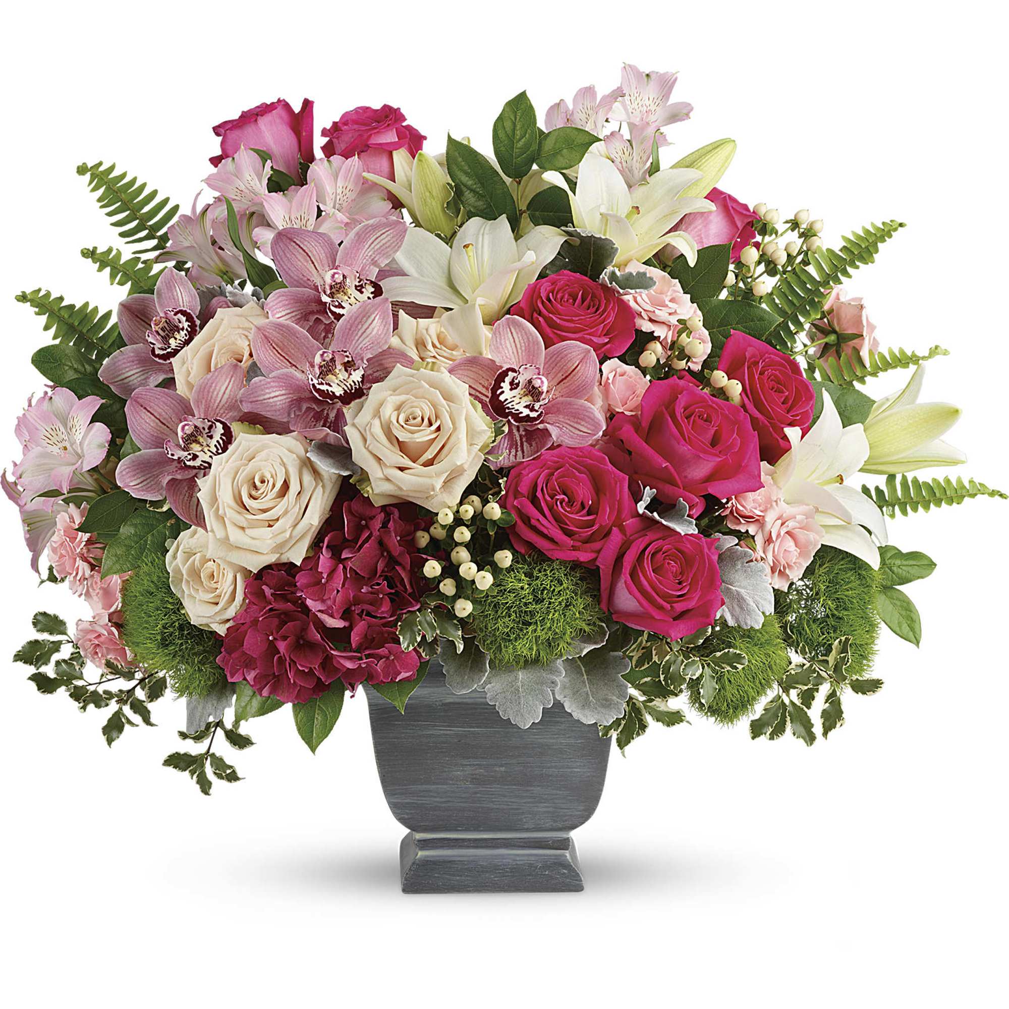Pink and white mixed flower arrangement in a gray pedestal vase