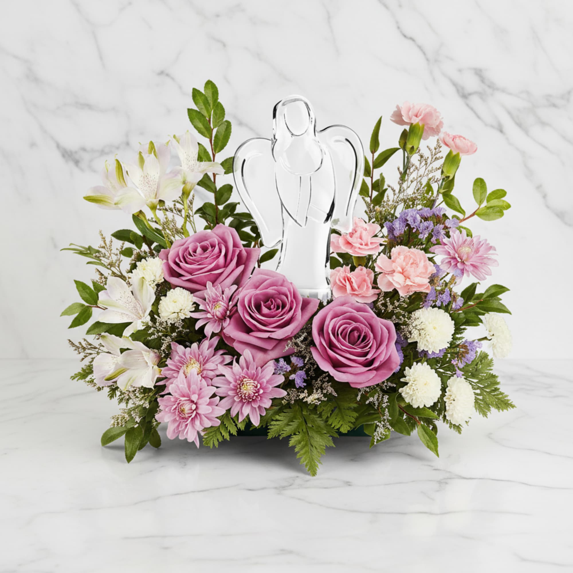 Bring peace and comfort with our In Heaven's Arms Bouquet, featuring soothing