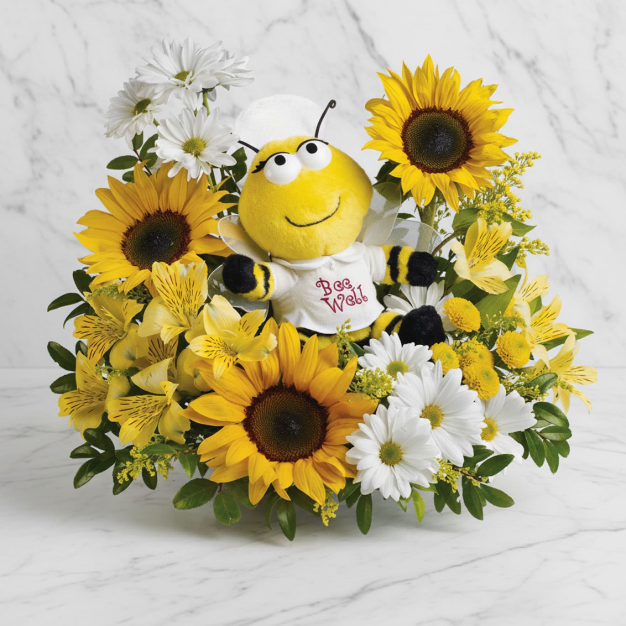 Sunflower and daisy arrangement with a plush bee in the center