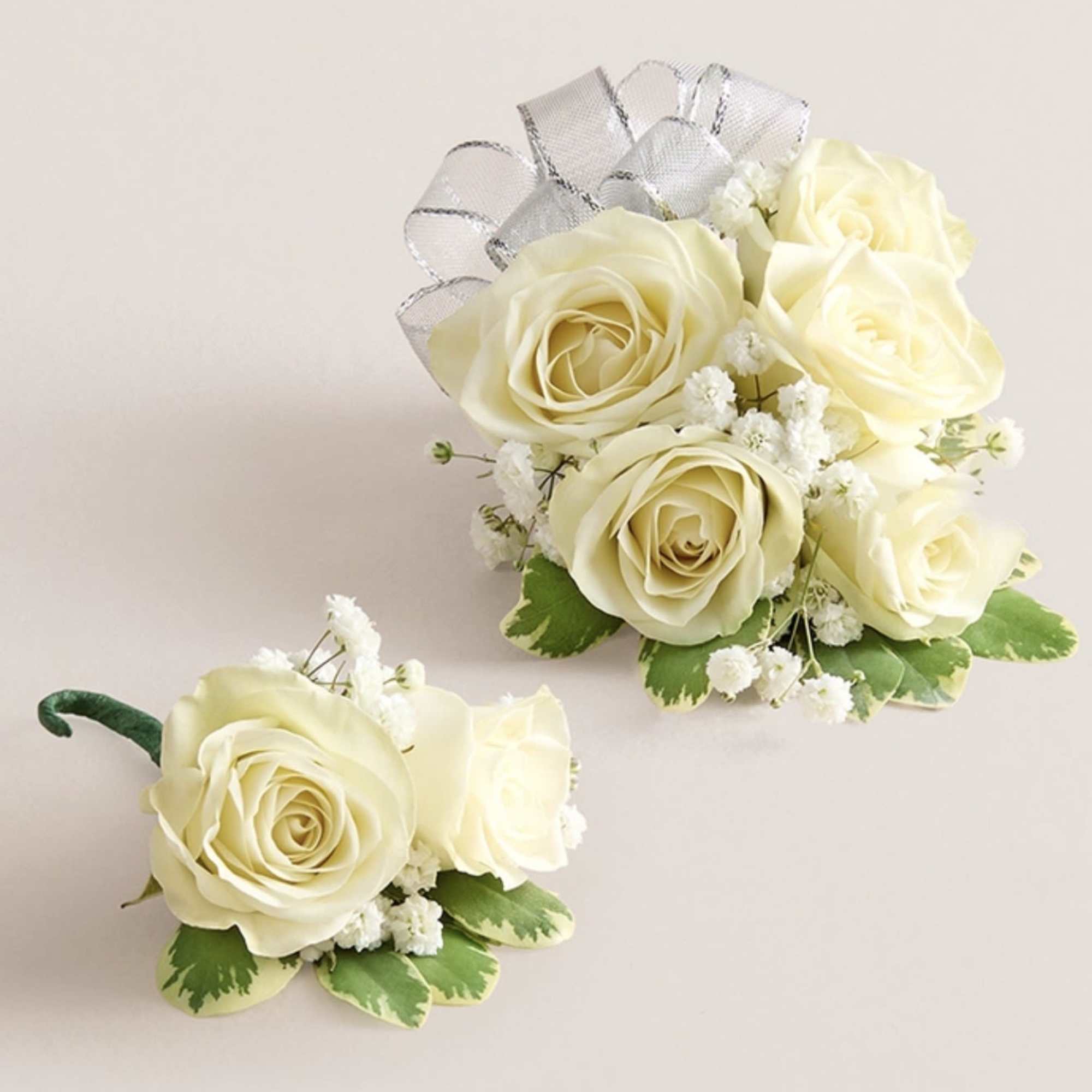 This elegant corsage and boutonniere set is thoughtfully designed to pair perfectly