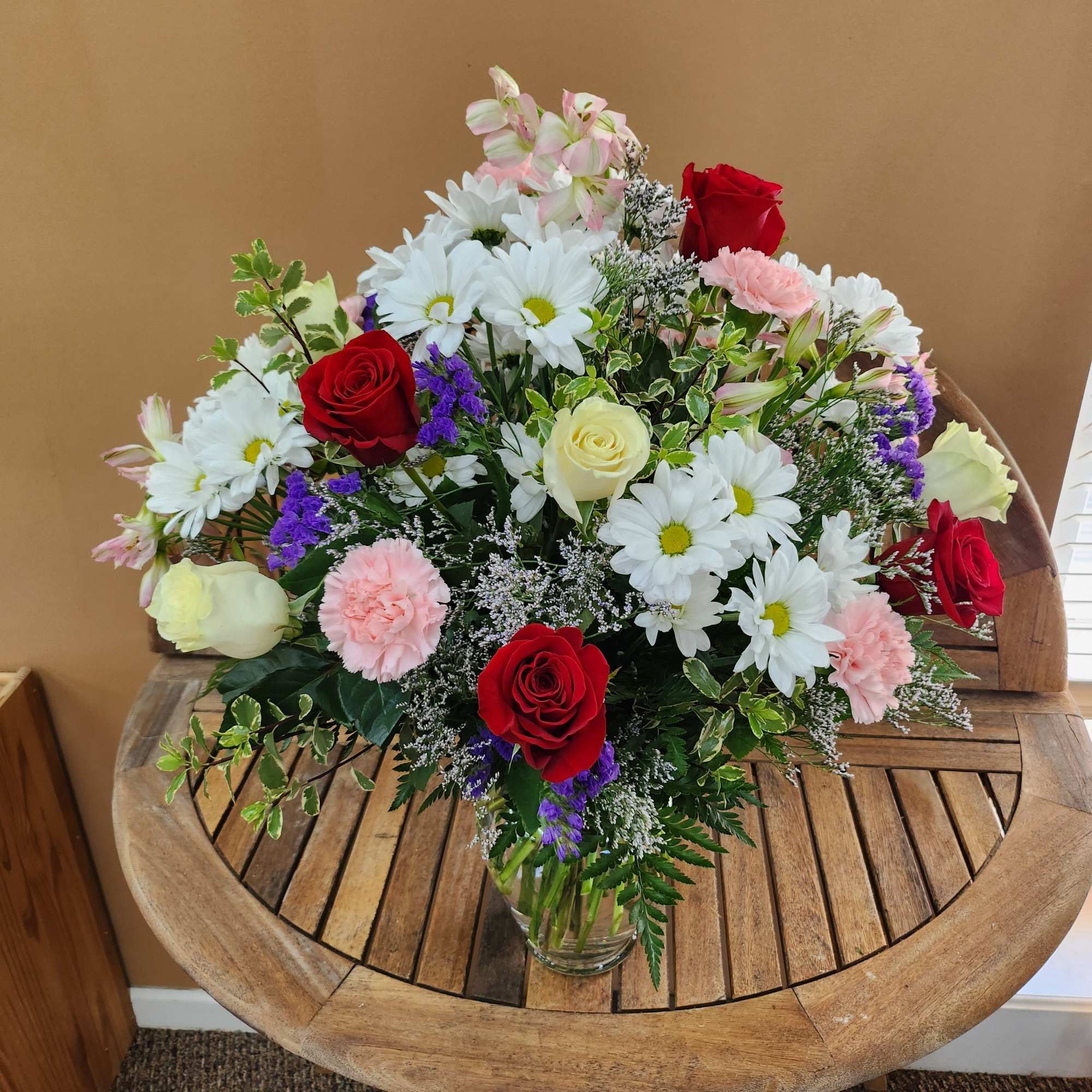 Mixed arrangement of roses, carnations,  daisies, and alstroemeria., photo 2 of 3