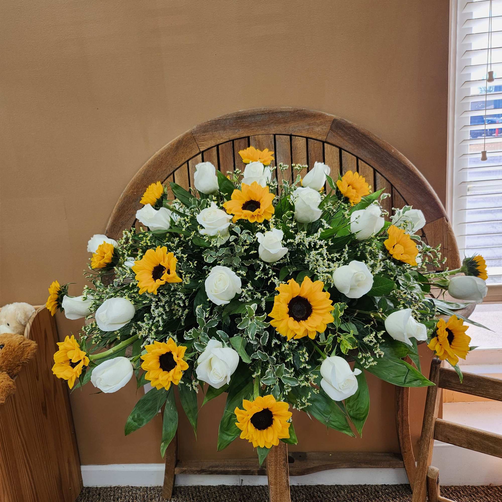 Casket cover with sunflowers, white roses, greenery and filler
, photo 2 of 2