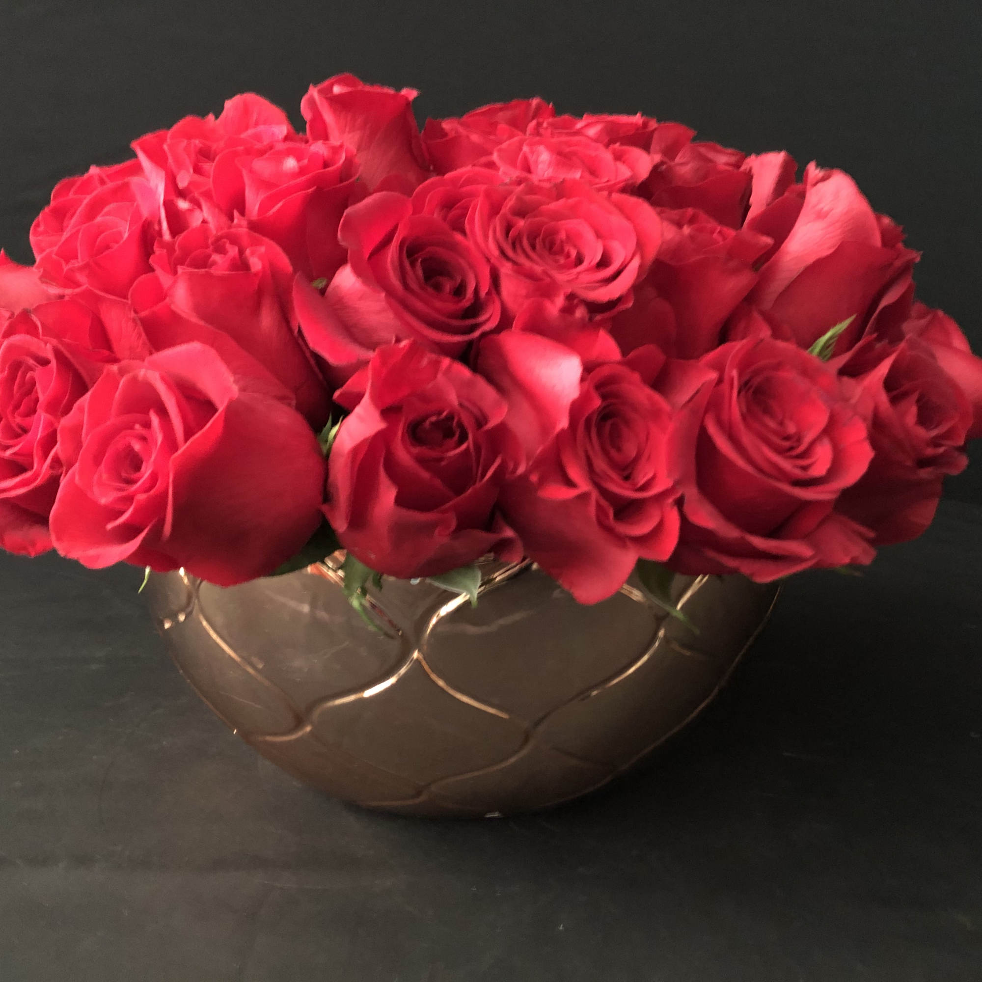 50  red roses in a modern rose gold bowl. She will