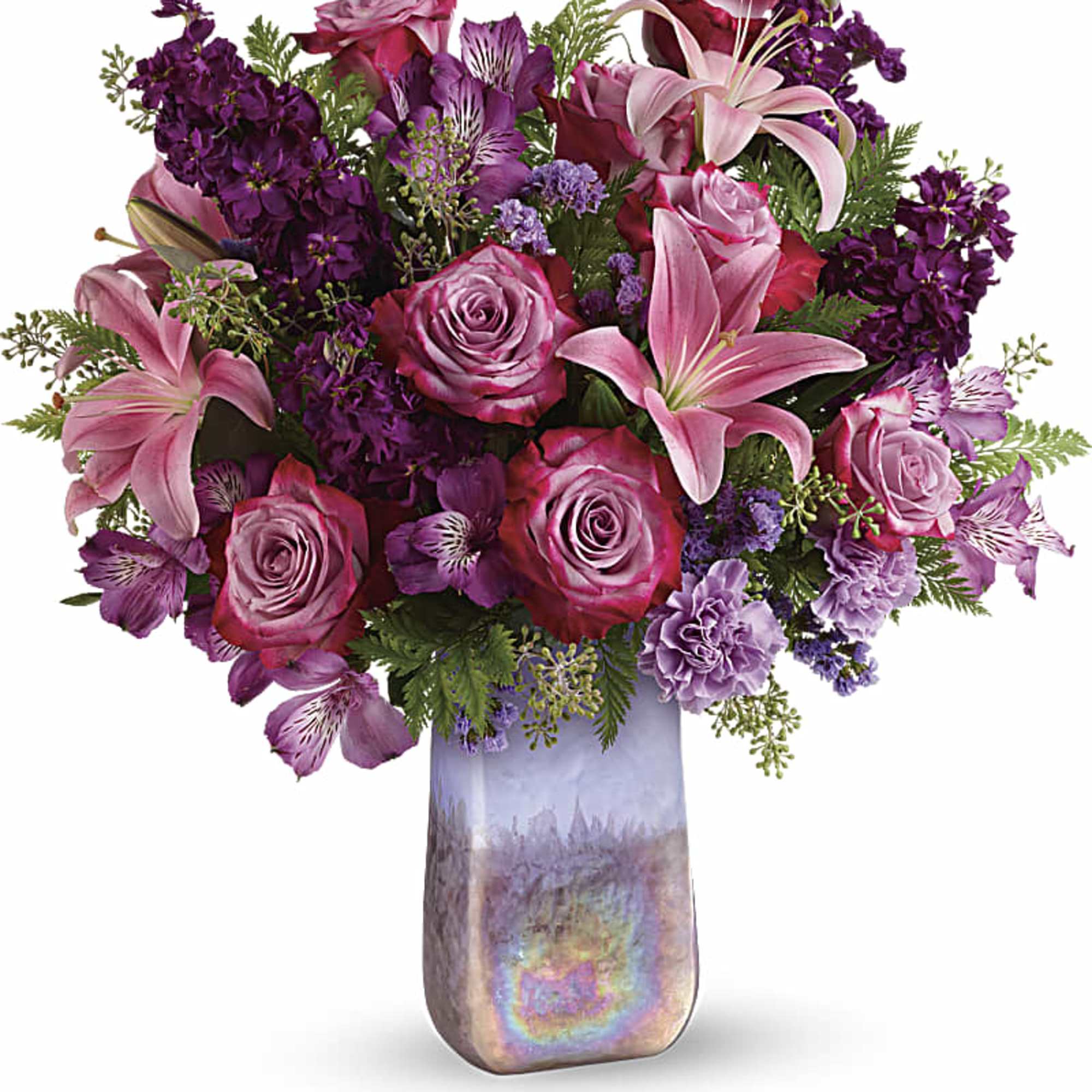 Pink and purple floral arrangement in a tall iridescent vase