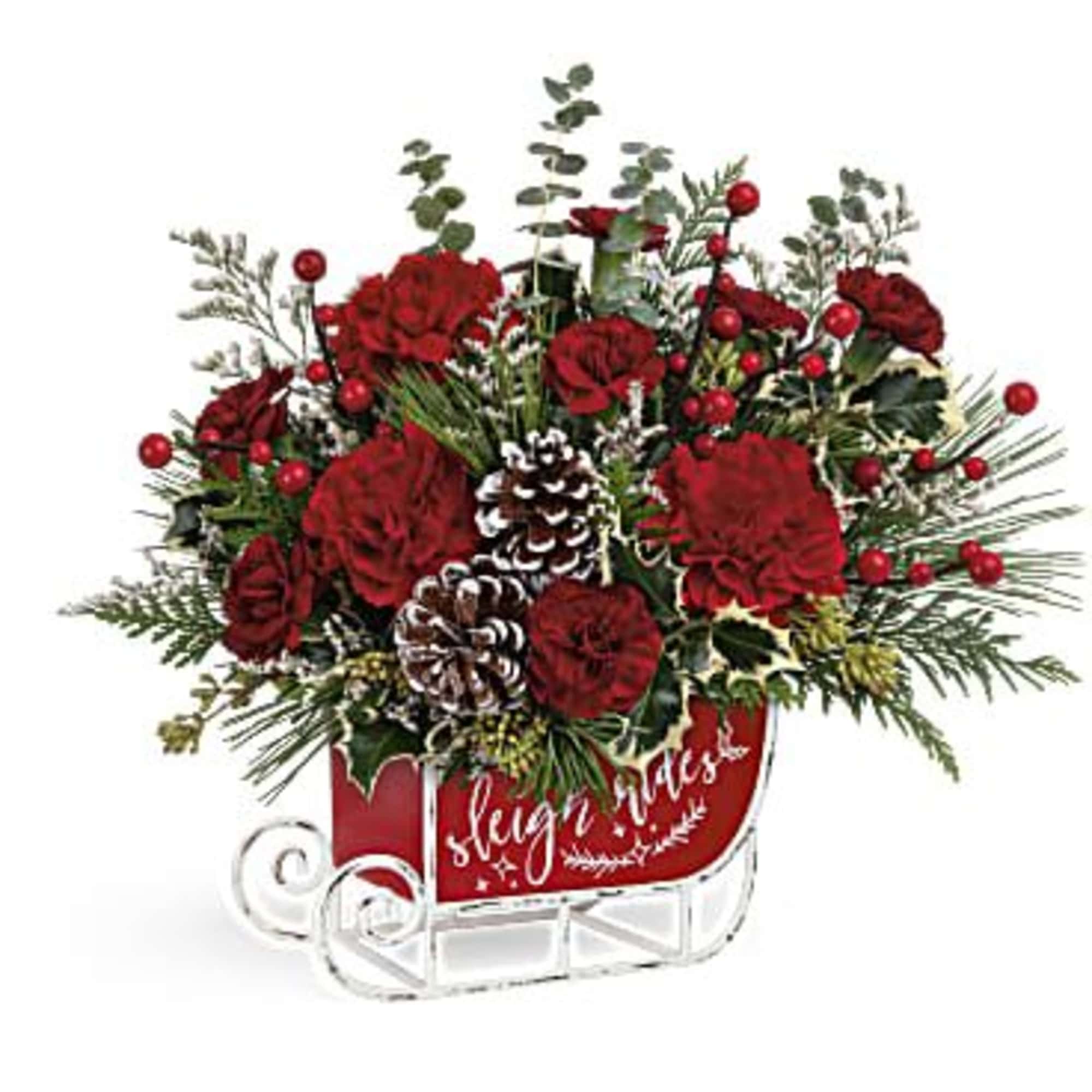 Red floral sleigh arrangement with pinecones and berries