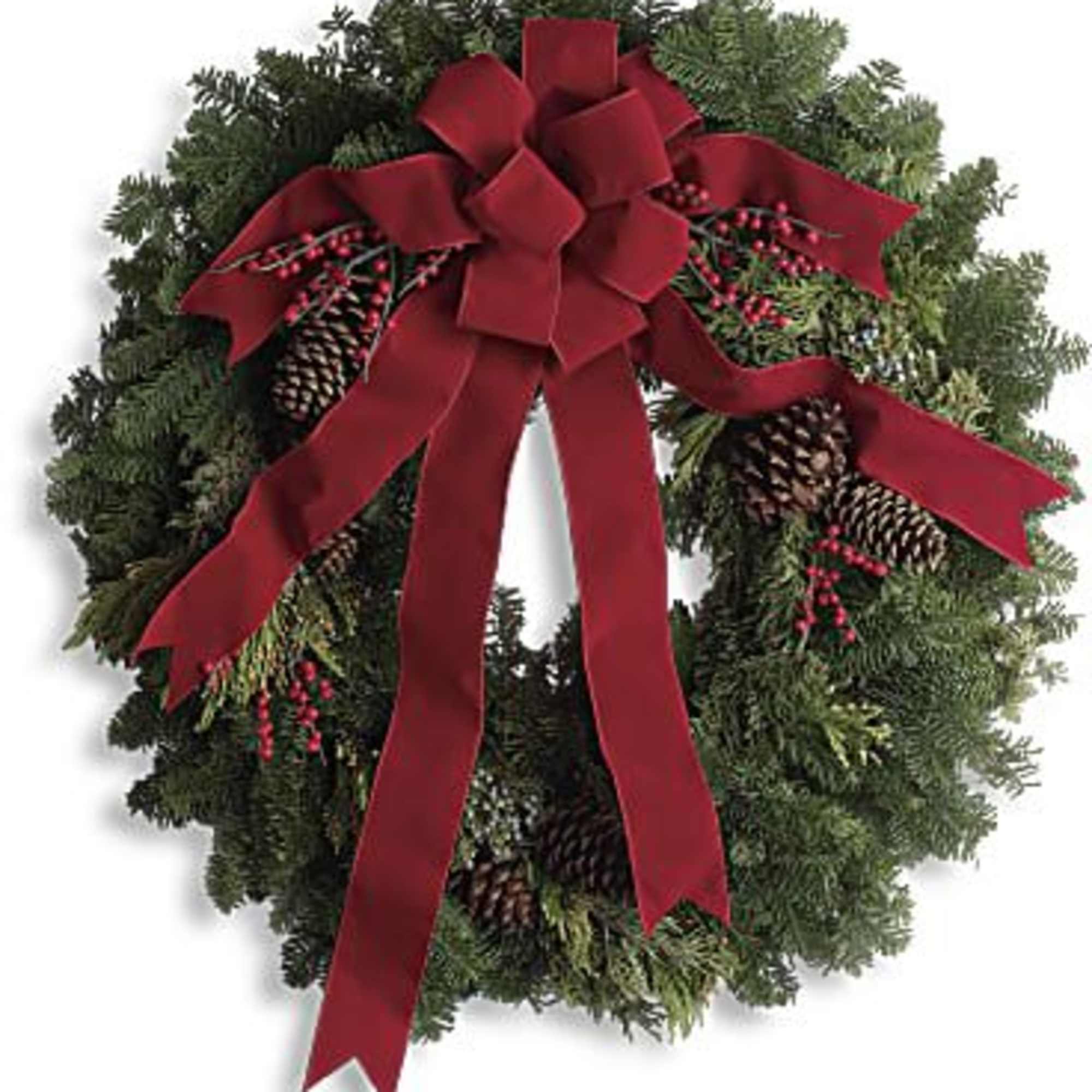 Christmas wreath with a red bow and pinecones