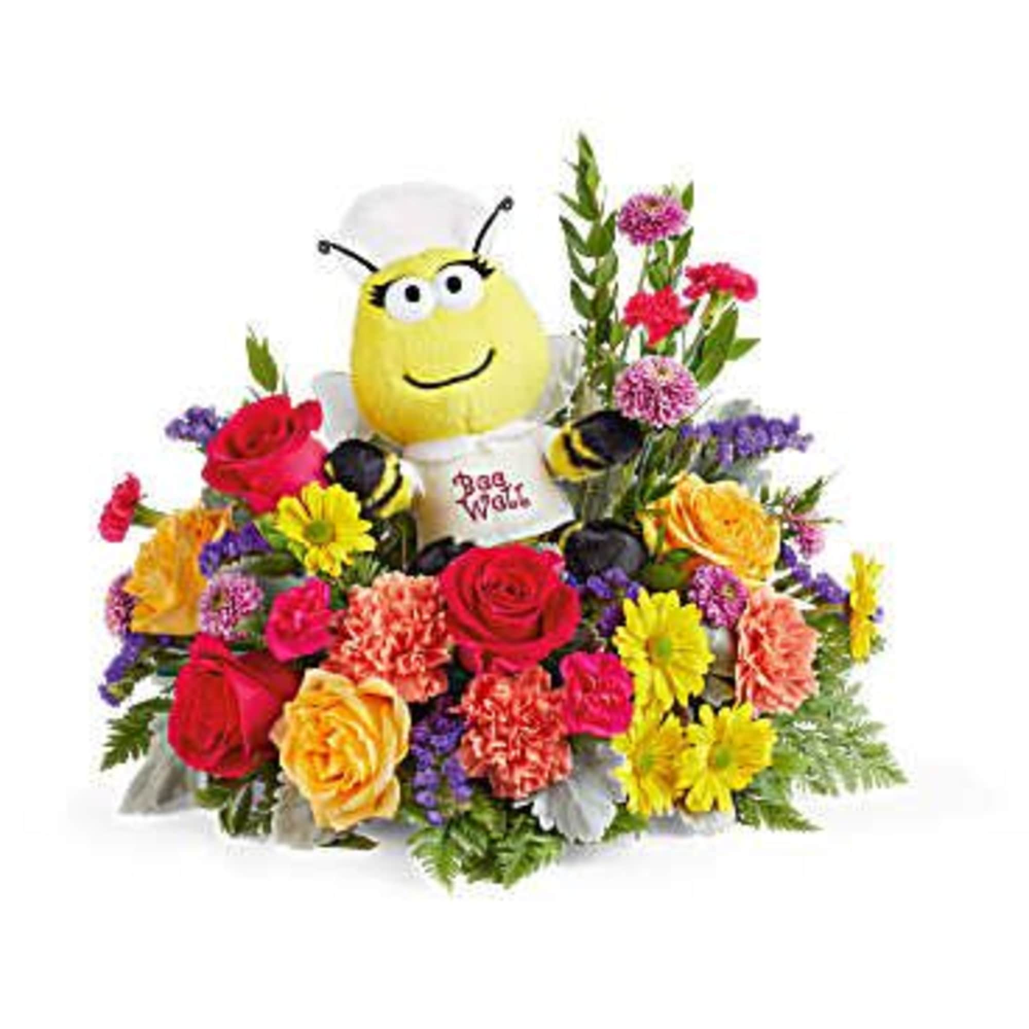 Bee plush surrounded by a colorful flower arrangement