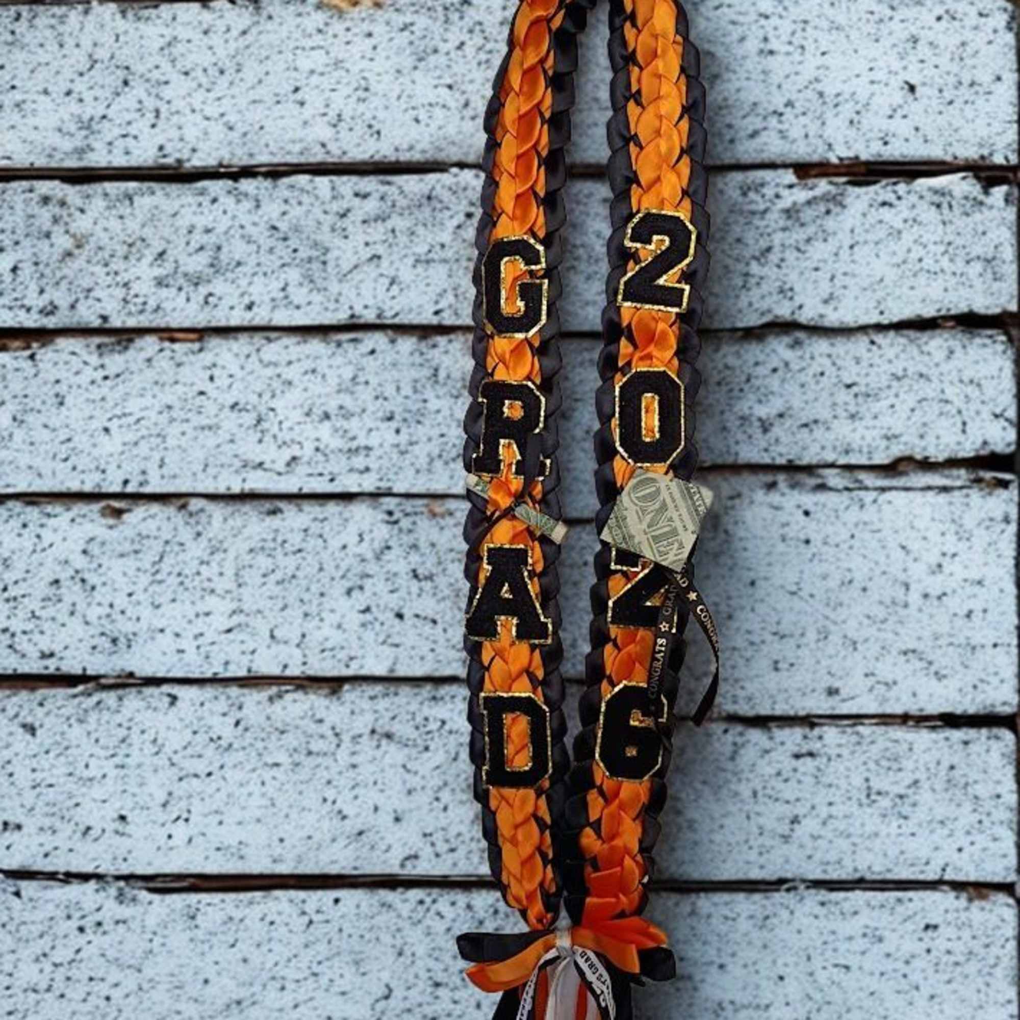 Make their graduation moment unmistakable with a braided ribbon lei in bold, photo 2 of 2