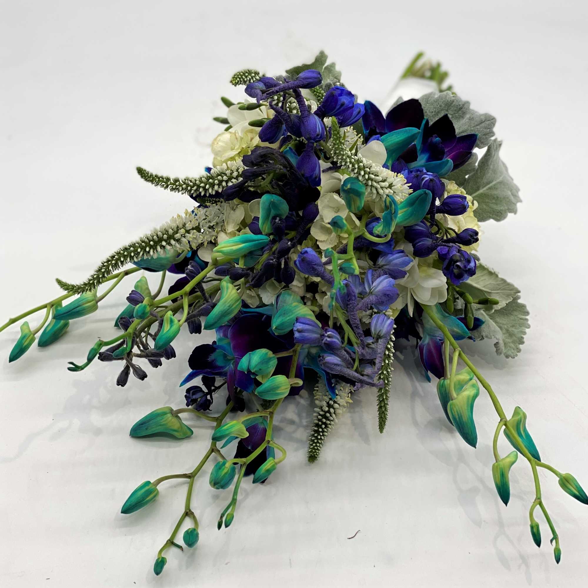 A fun mix of blue orchids, white veronica and blue delphinium sets, photo 2 of 3