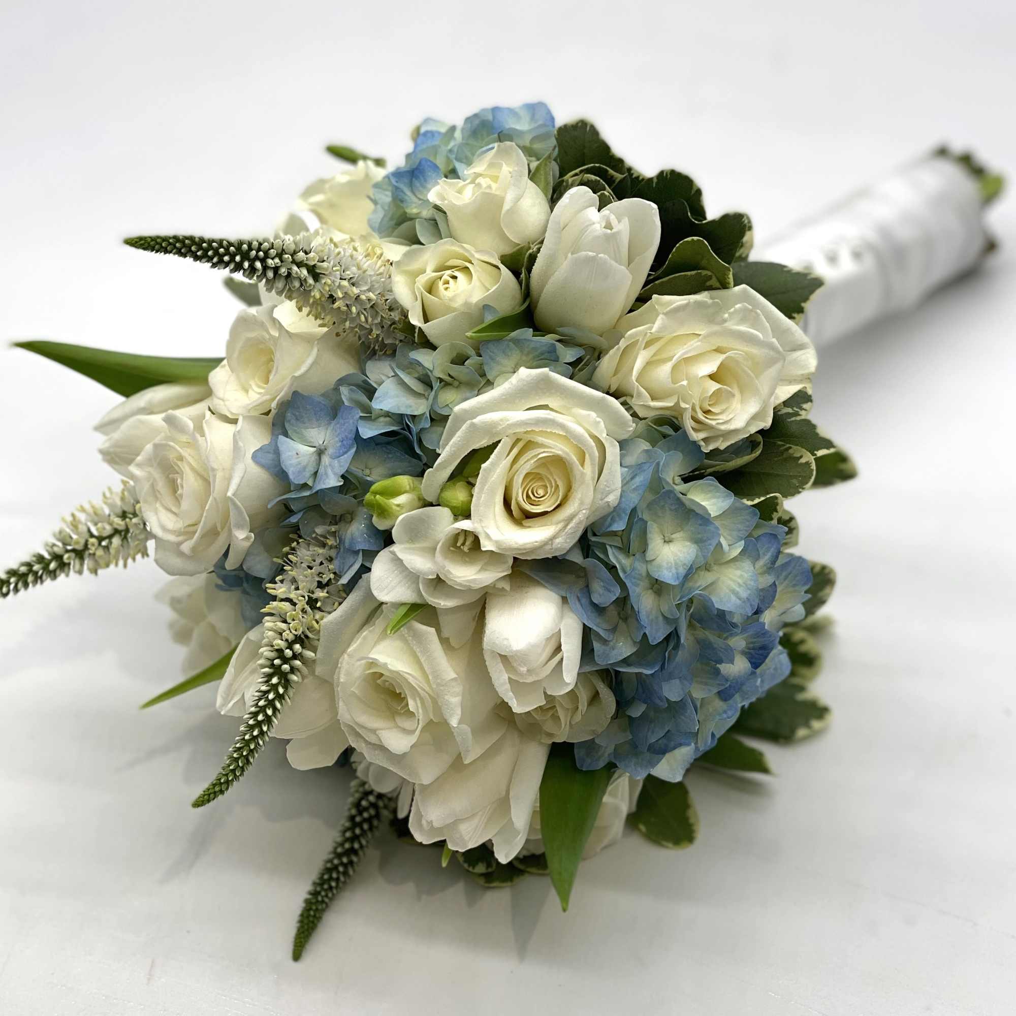 A lush mix of white flowers designed within a blue hydrangea. , photo 3 of 4