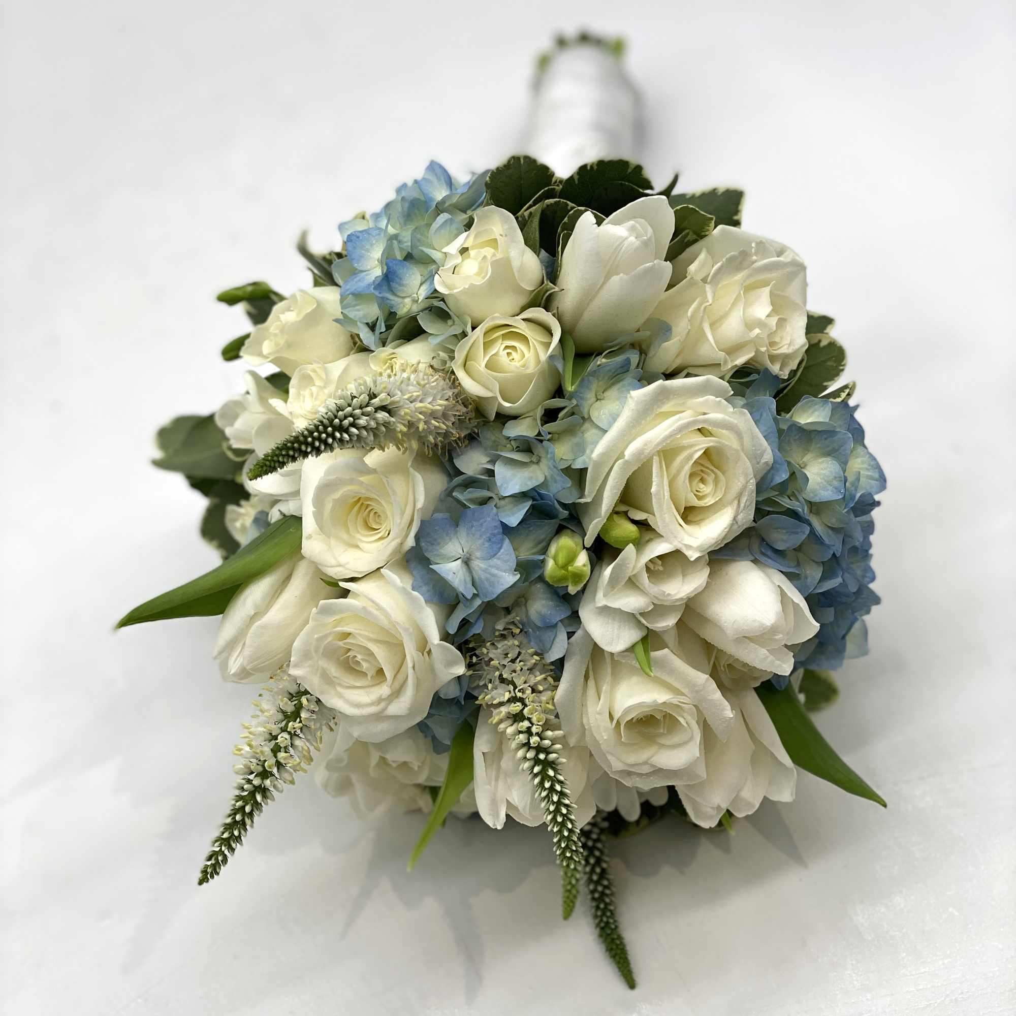 A lush mix of white flowers designed within a blue hydrangea. , photo 4 of 4