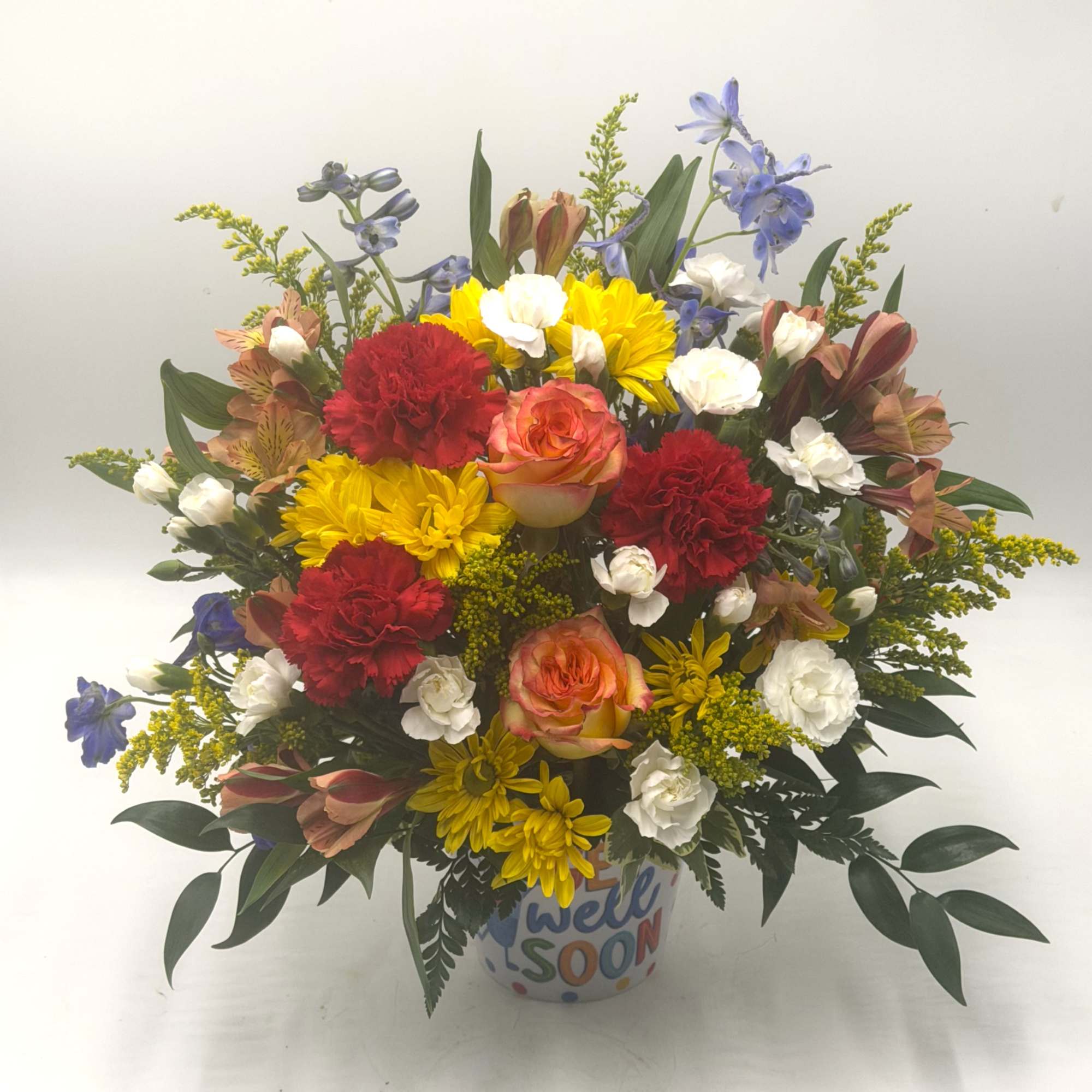 A vibrant get-well arrangement bursting with cheerful yellow daisies, bi-color roses, red, photo 2 of 3
