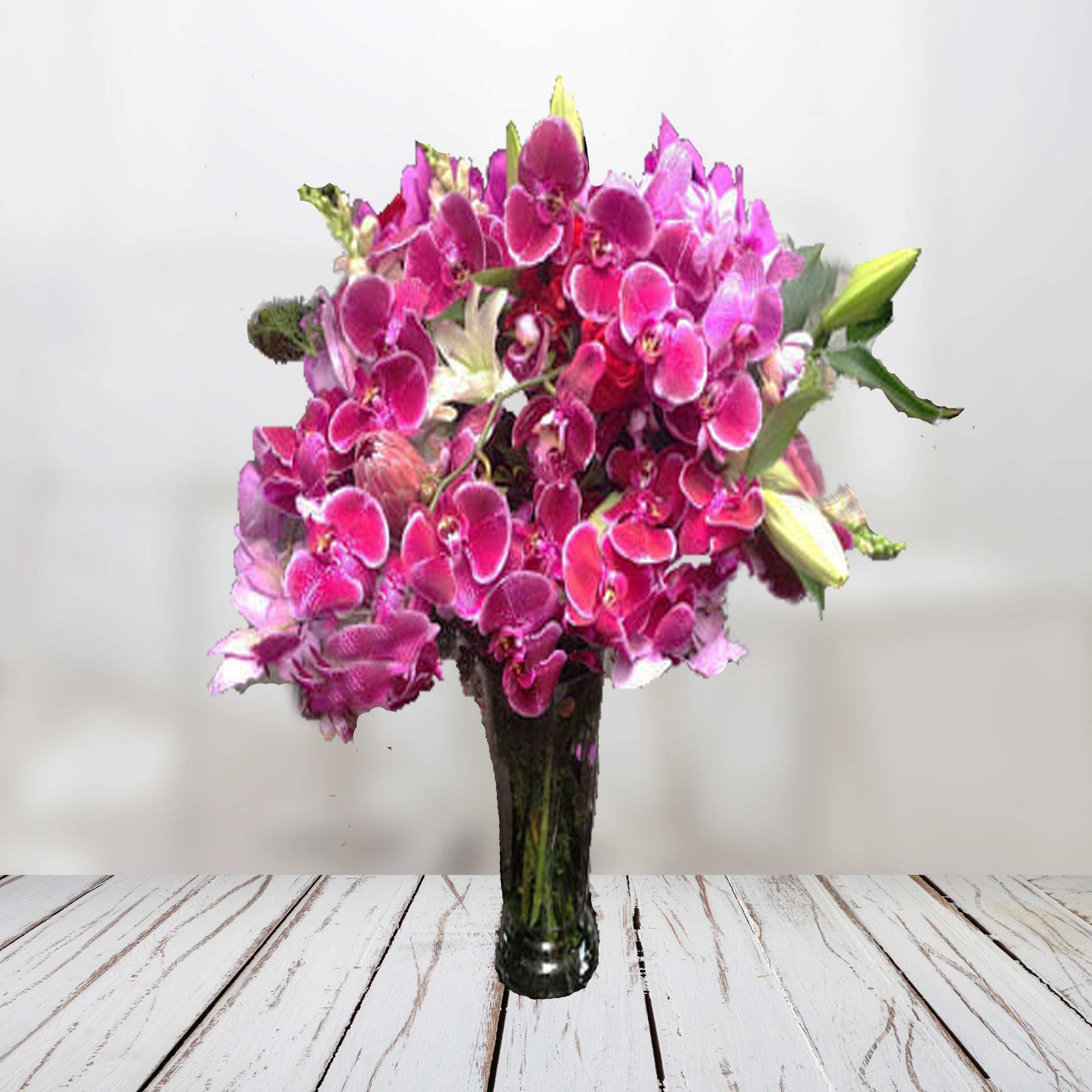 Pink orchid bouquet in a clear glass vase