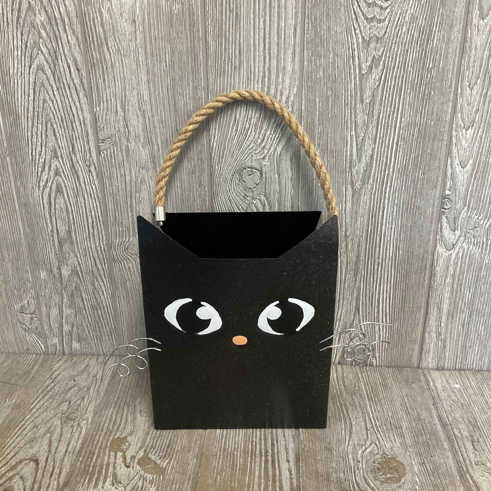 Black cat-shaped gift bag with rope handle and wire whiskers