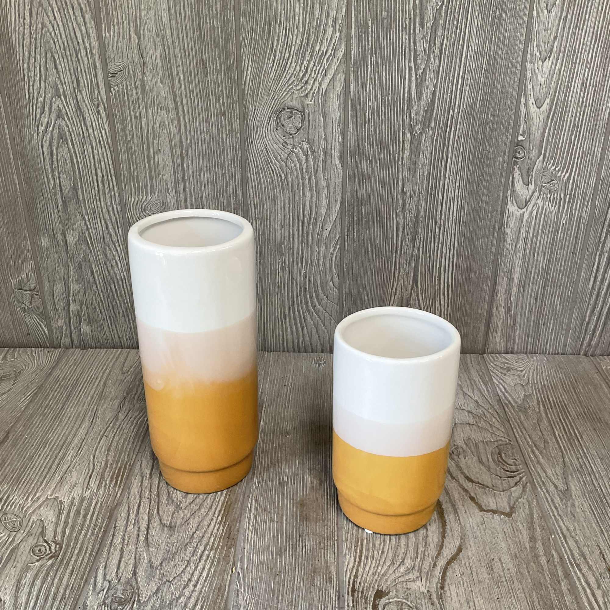 Two ceramic vases with white and yellow glaze