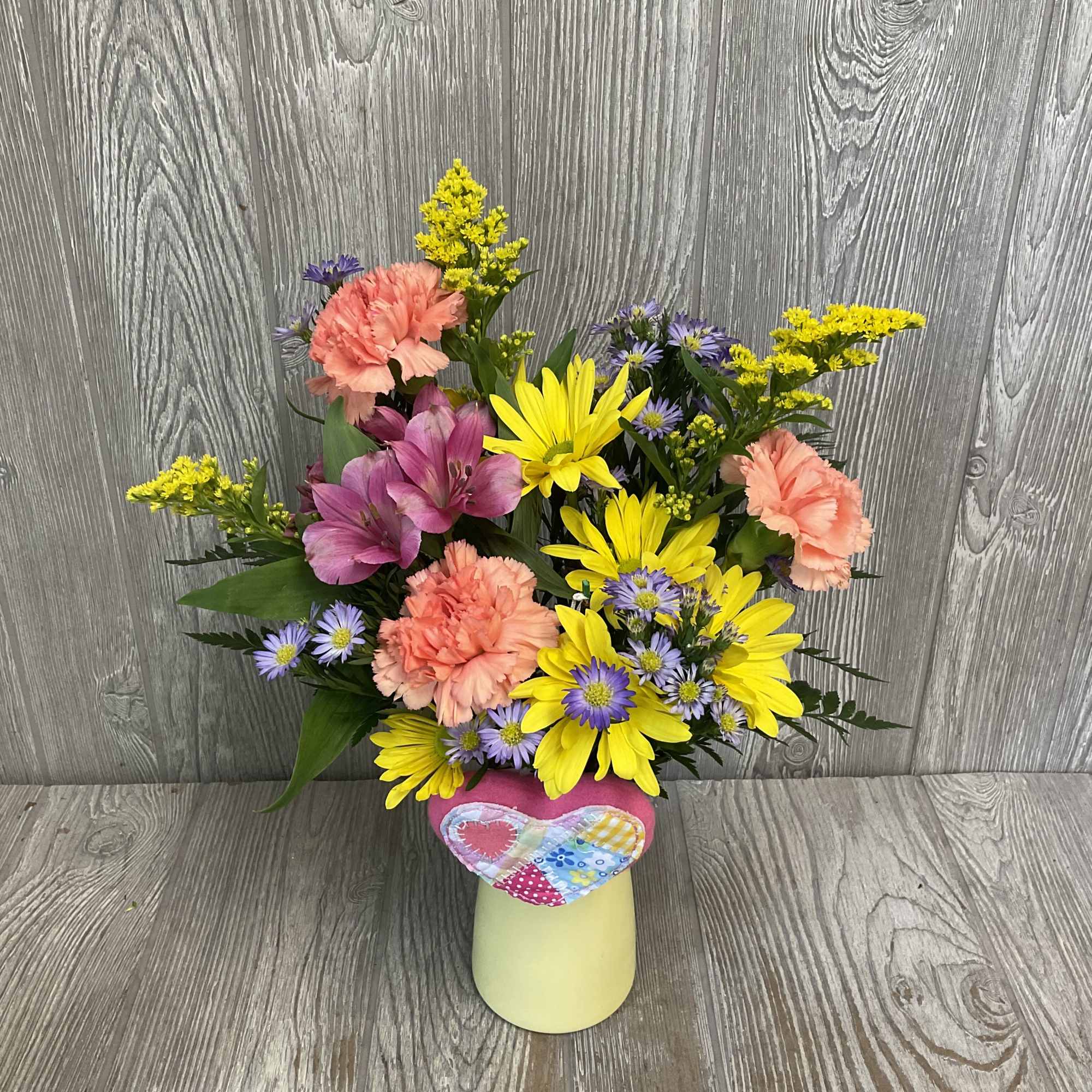A beautiful colorful arrangement of fresh cut flowers arranged in a vase, photo 2 of 4