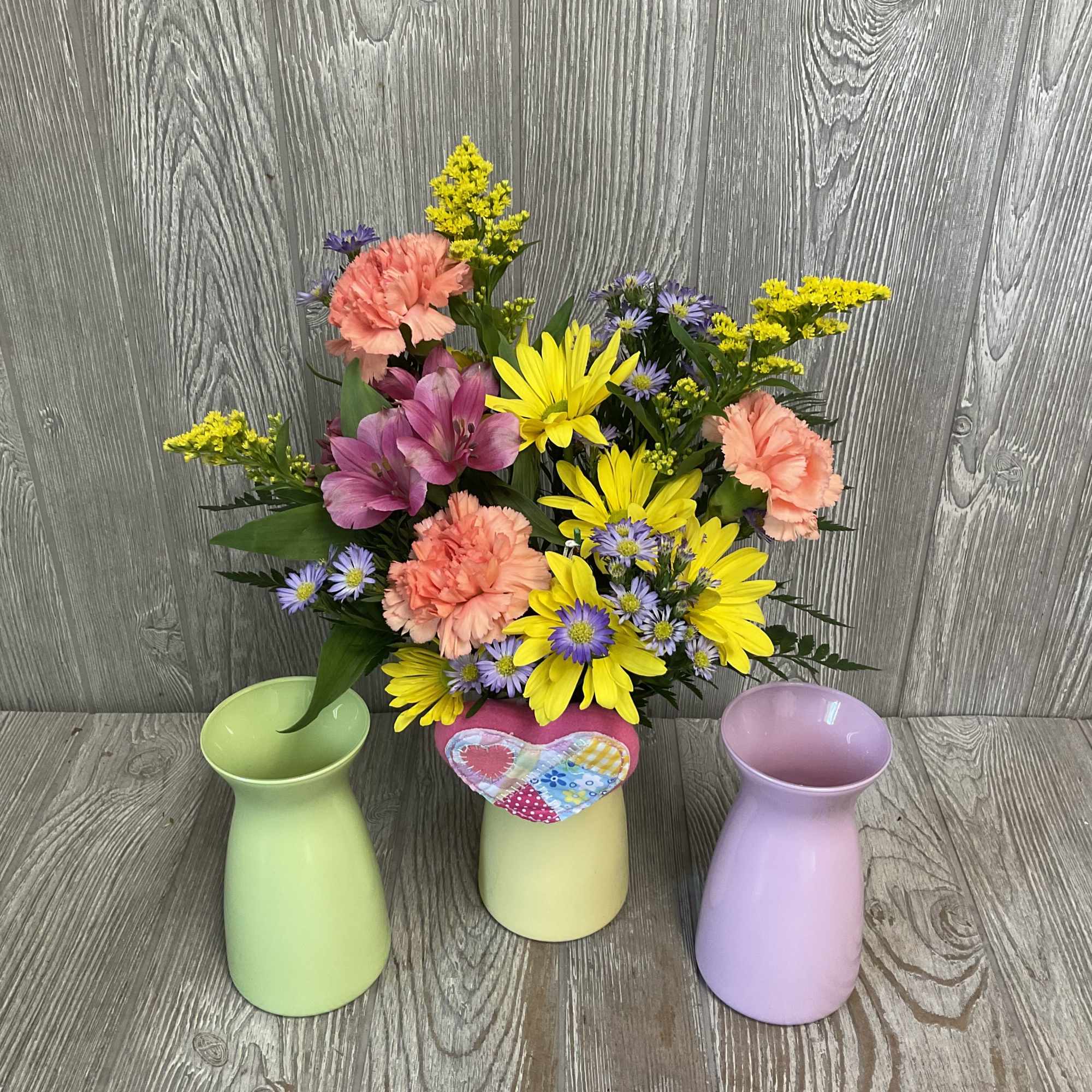 A beautiful colorful arrangement of fresh cut flowers arranged in a vase, photo 3 of 4
