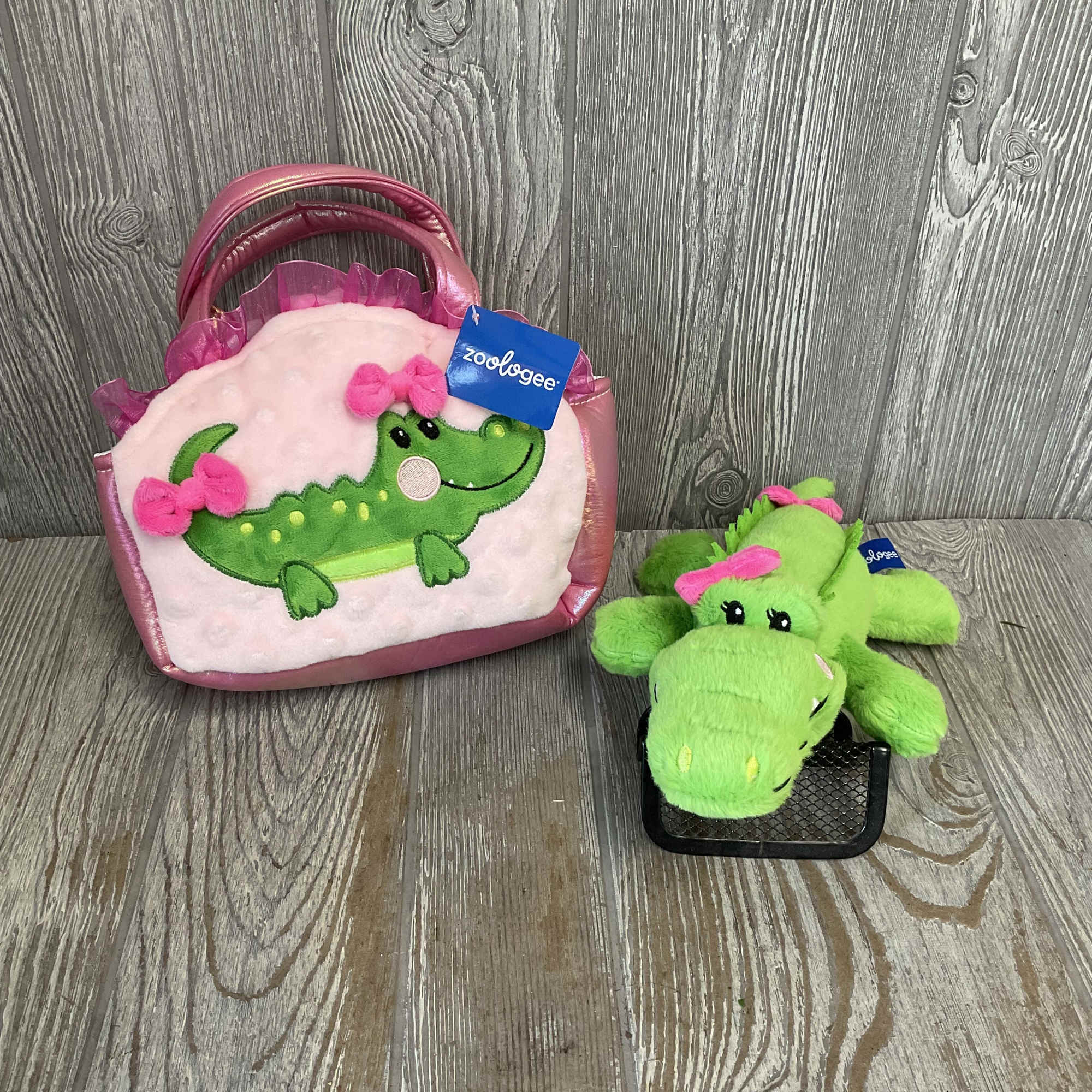 A plush pink handbag with a bright green alligator peeking out makes, photo 2 of 3