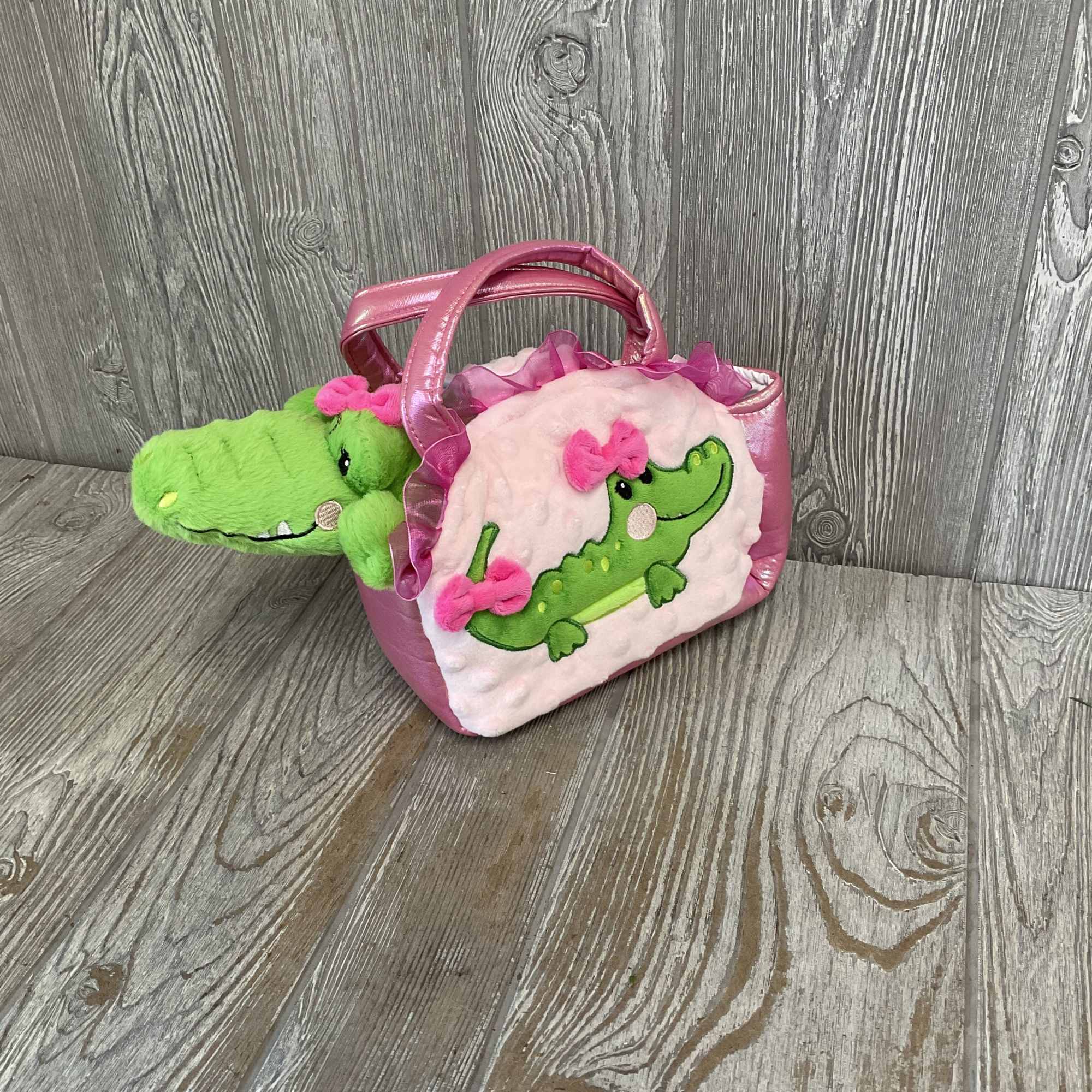 A plush pink handbag with a bright green alligator peeking out makes, photo 3 of 3
