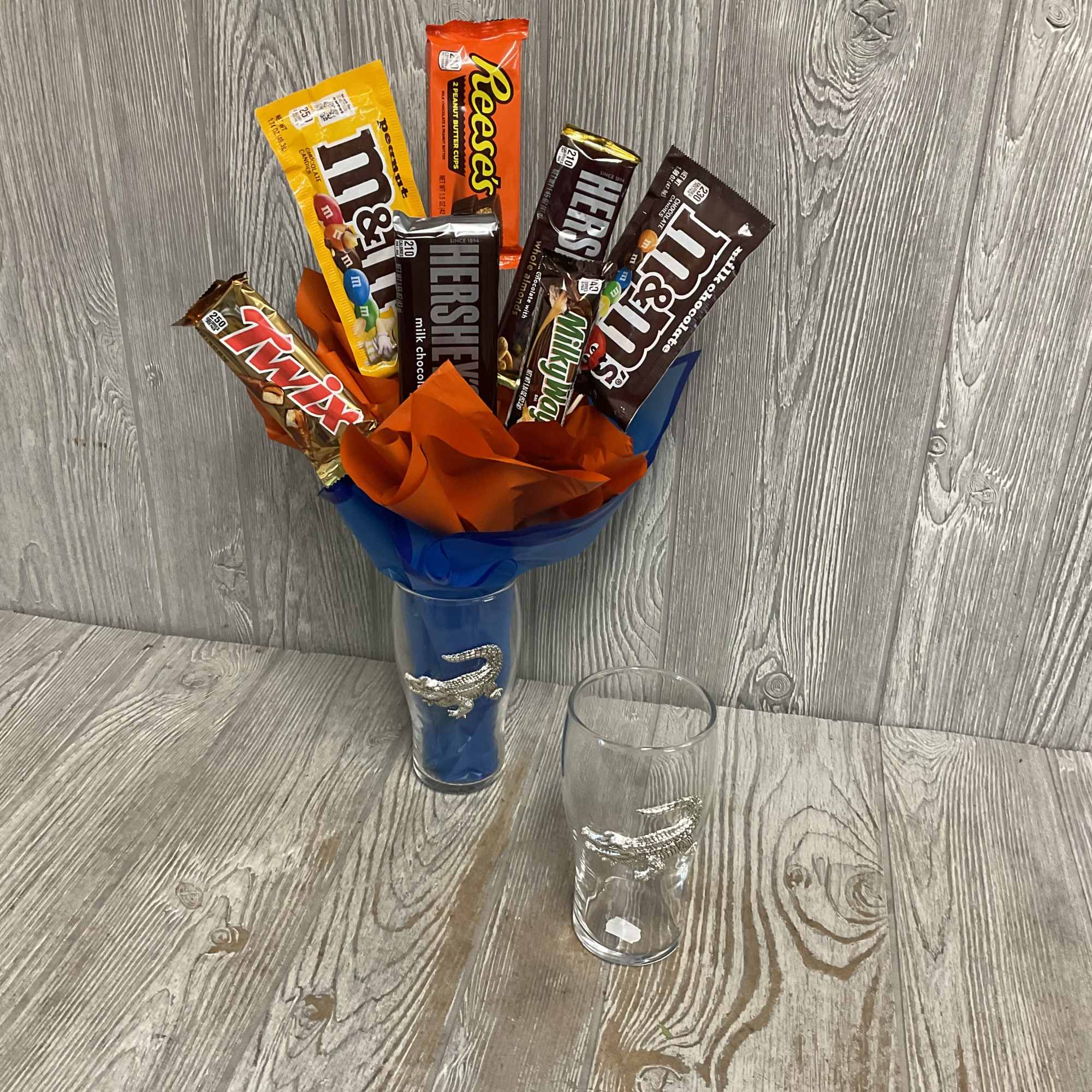 Candy bouquet in a glass vase with assorted chocolate bars