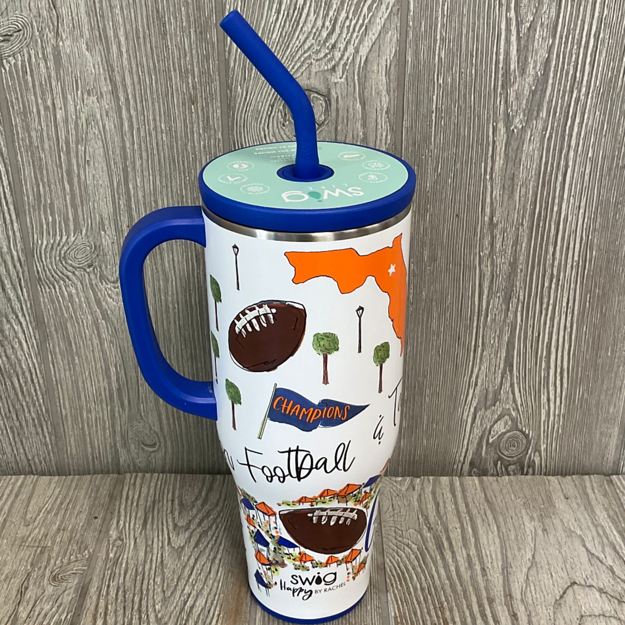Football-themed insulated tumbler with a blue handle and straw