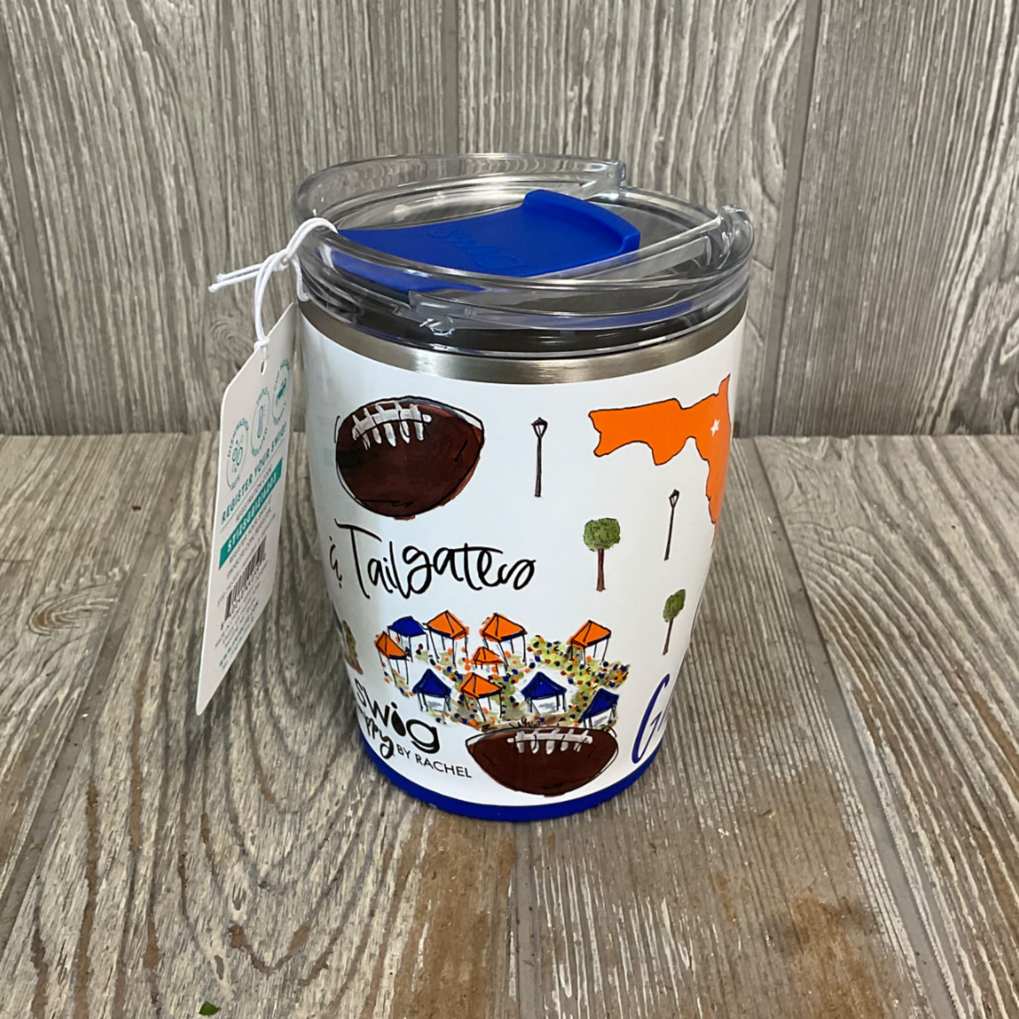 Insulated tumbler with a football-themed wrap and clear lid