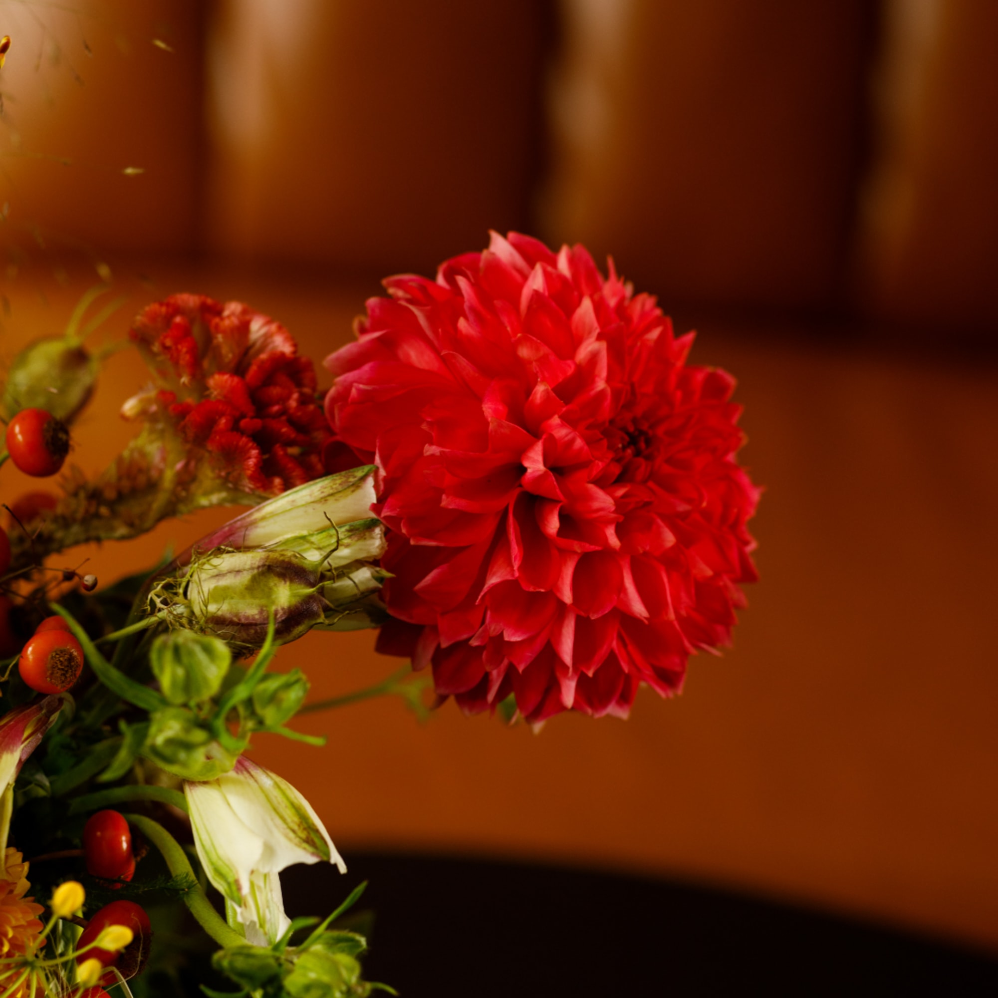 Red dahlia bouquet with mixed accent flowers and berries