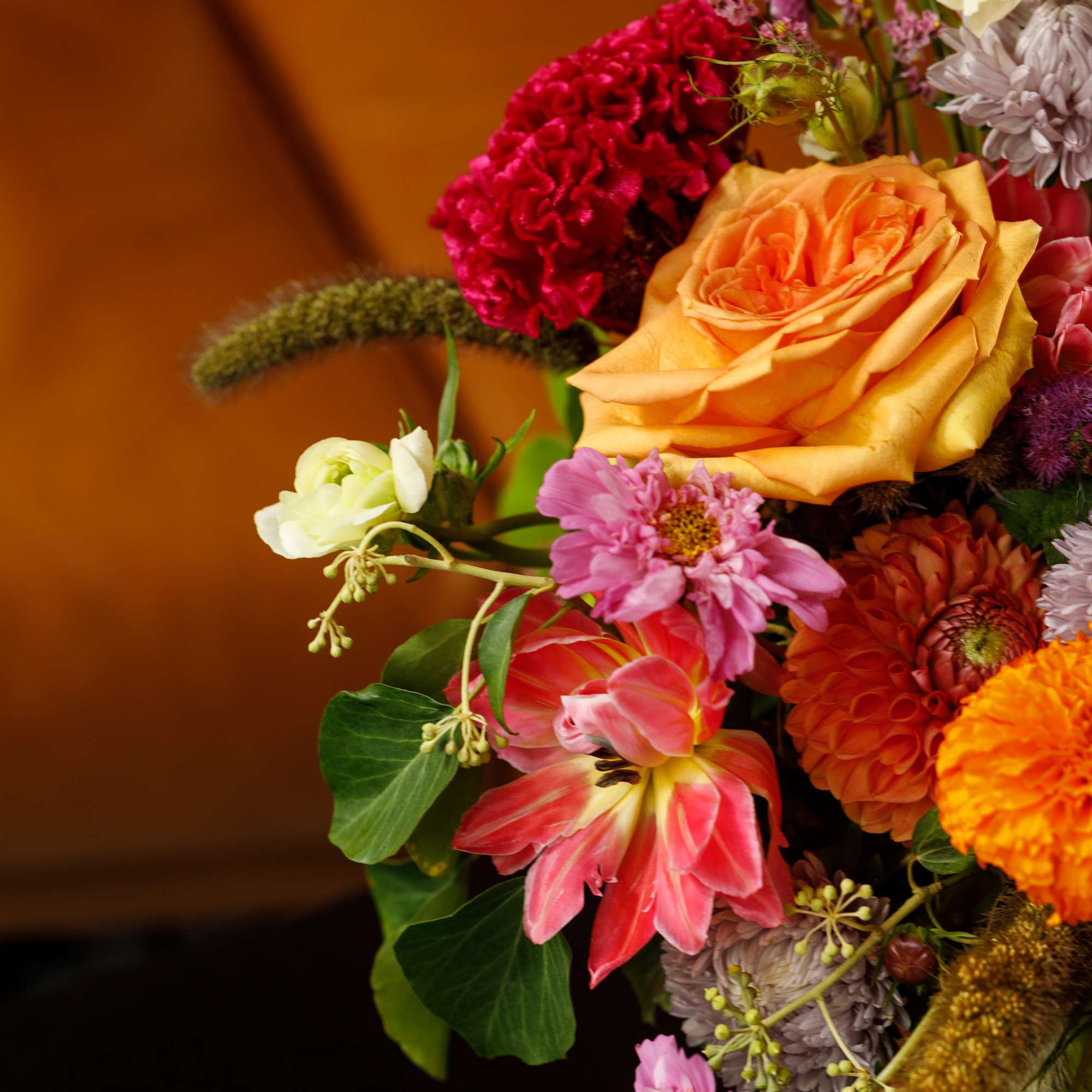 Colorful mixed bouquet with roses, tulips, and daisies