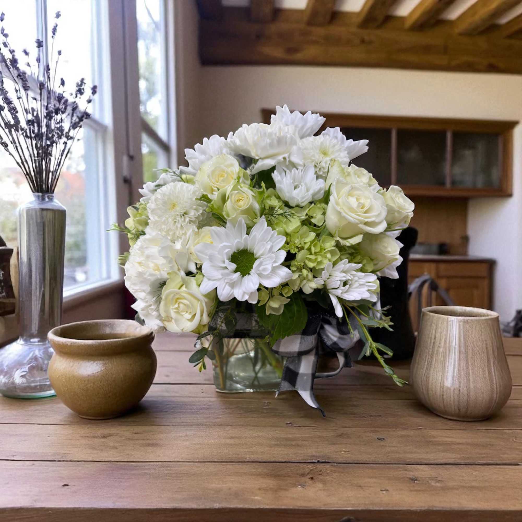 Bring rustic charm home with Farmhouse Fabulous, a fresh flower arrangement featuring