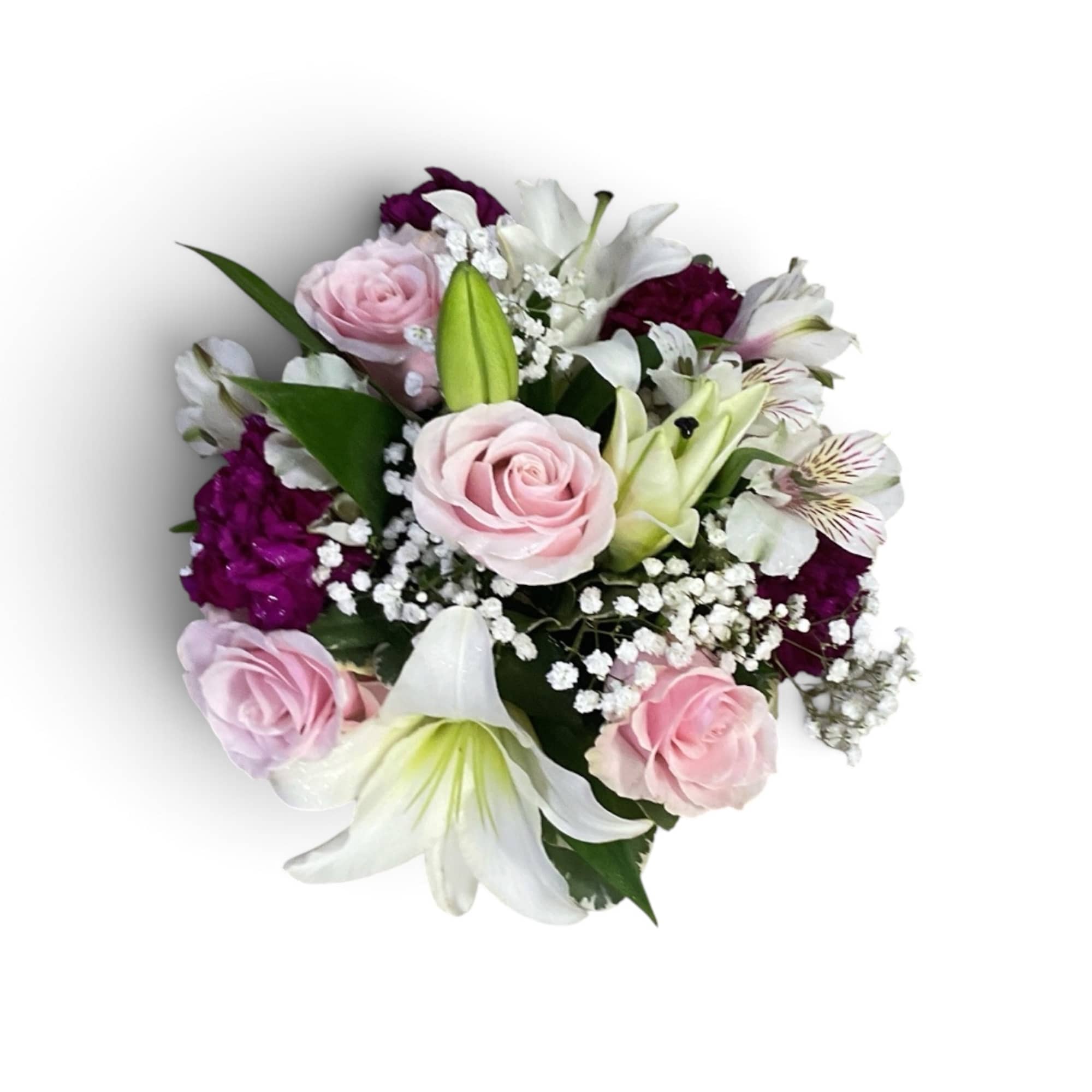 Pink roses and white lilies with purple accents in a compact bouquet