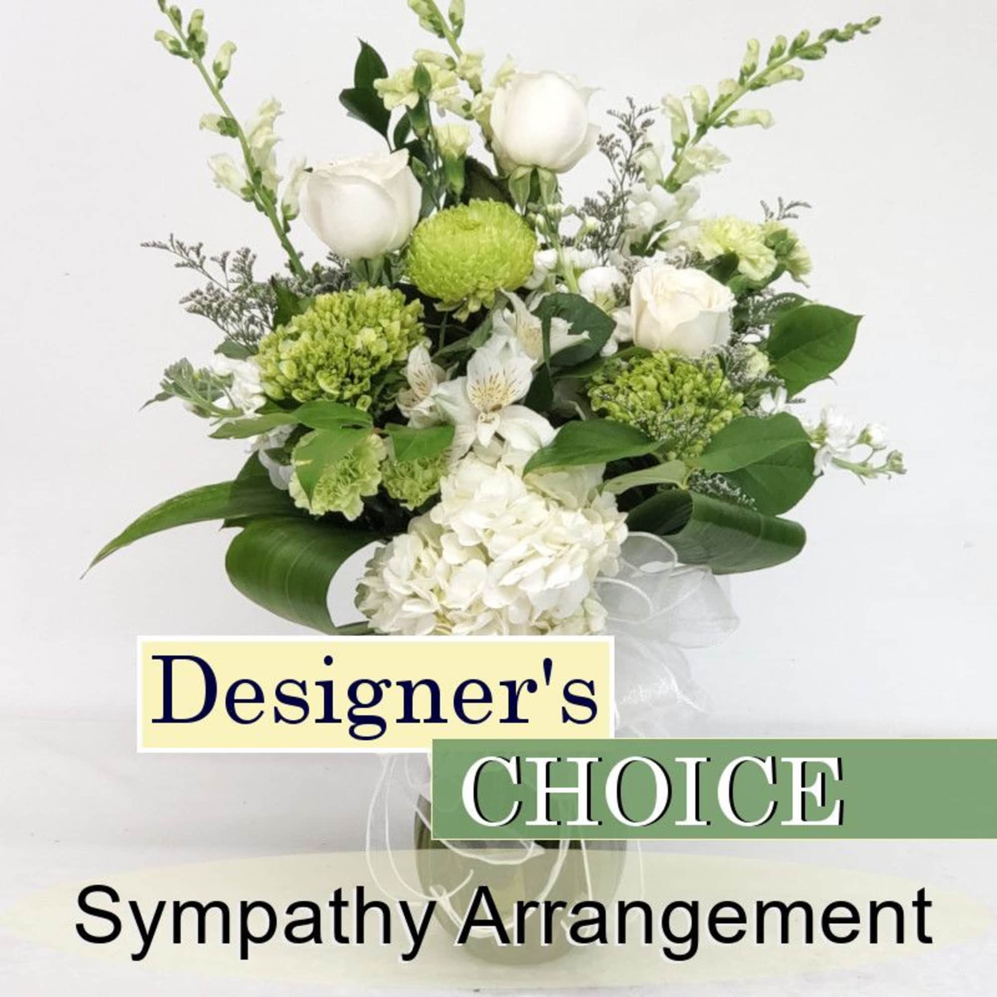 White and green sympathy arrangement with roses and hydrangea in a vase